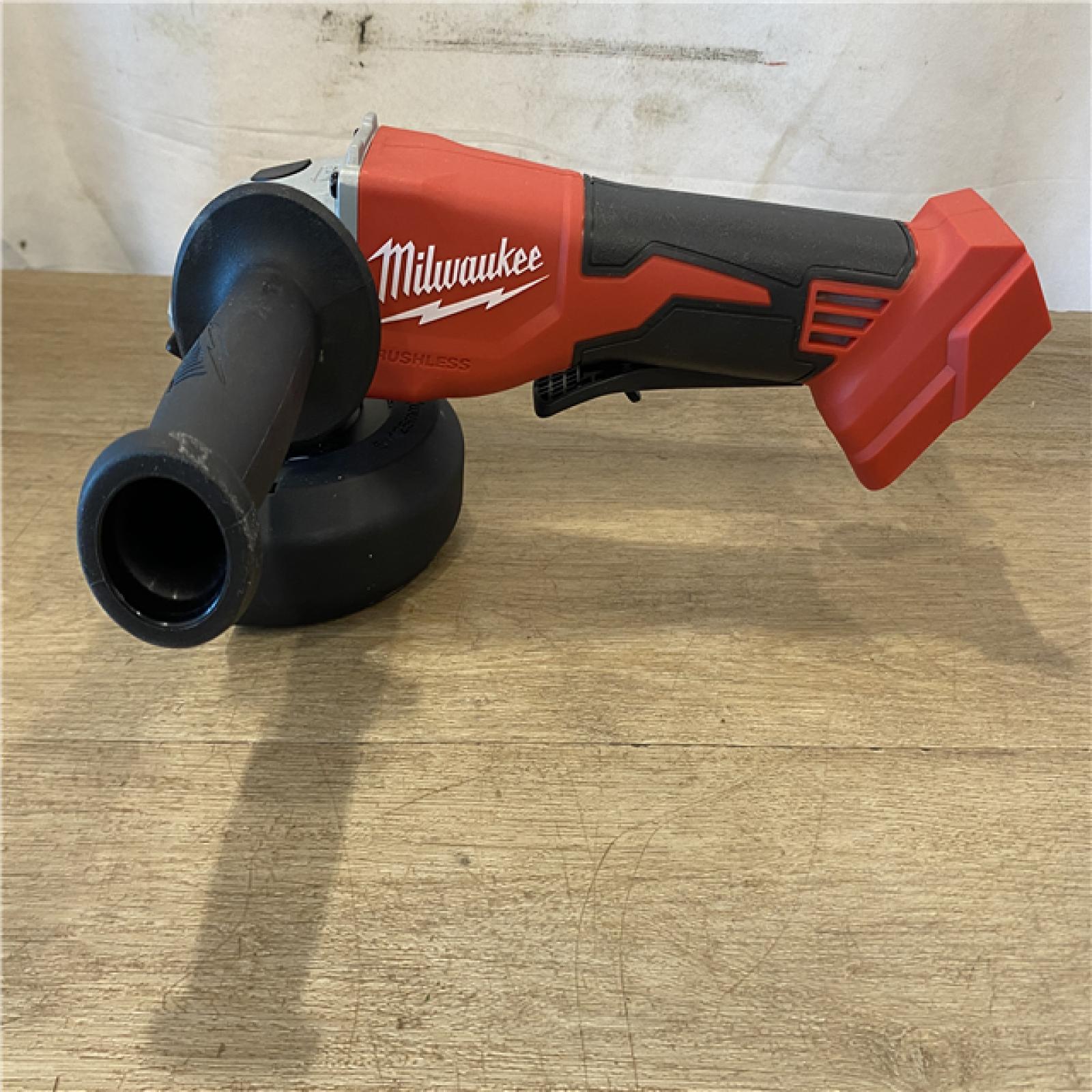 AS-IS Milwaukee 18V Lithium-Ion Brushless Cordless 4-1/2 in./5 in. Grinder w/Paddle Switch (Tool-Only)