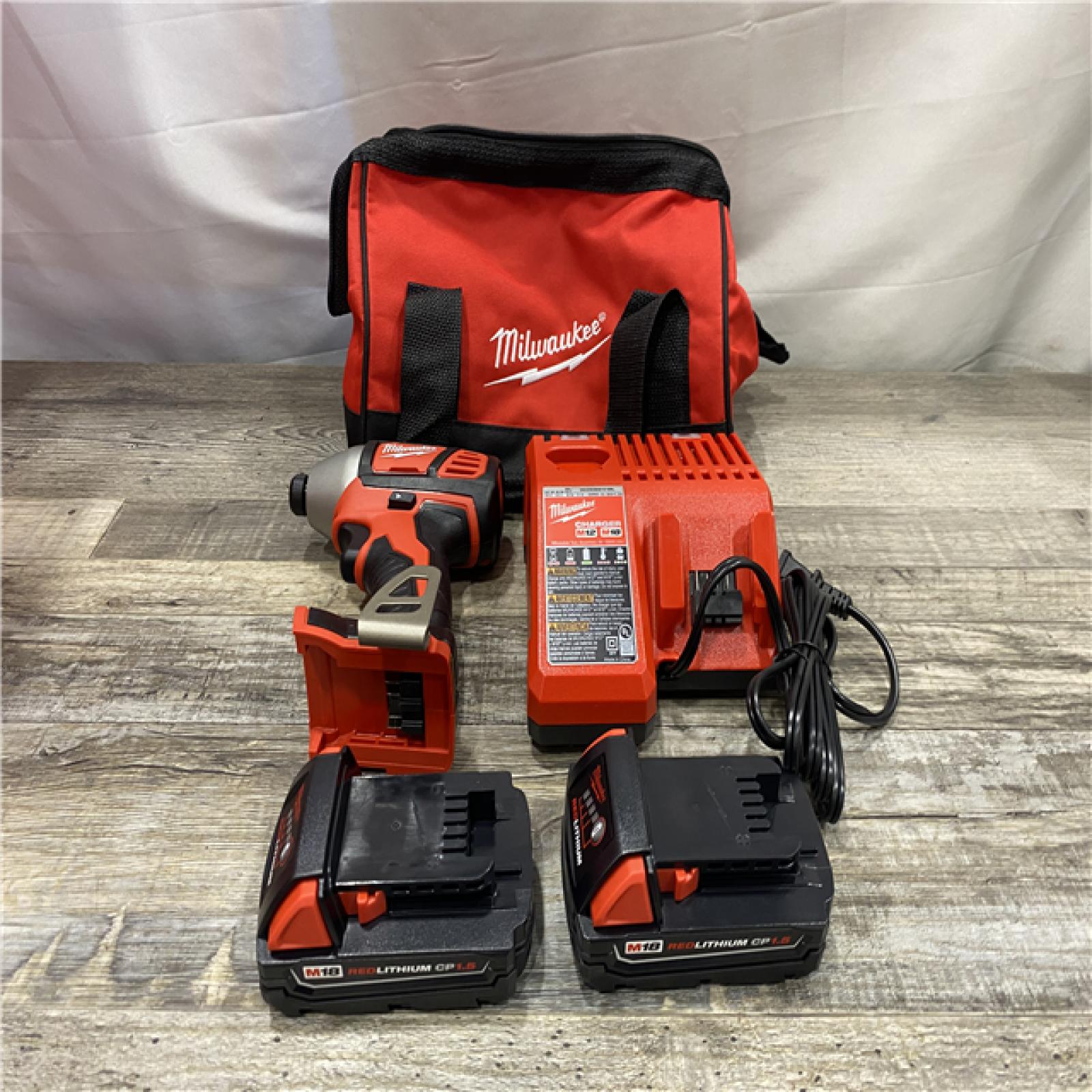 AS-IS Milwaukee 18V Lithium-Ion Cordless 1/4 in. Impact Driver Kit