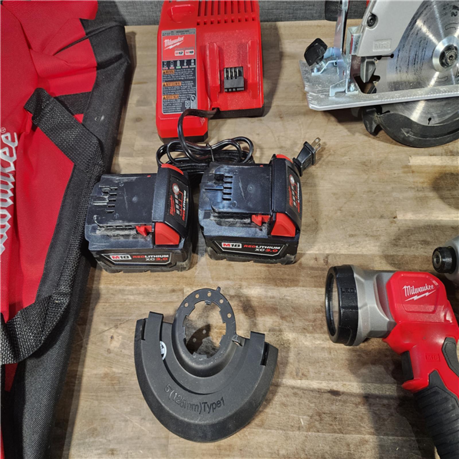 HOUSTON LOCATION - AS-IS Milwaukee M18 18-Volt Lithium-Ion Cordless Combo Kit 7-Tool with 2-Batteries, Charger and Tool Bag