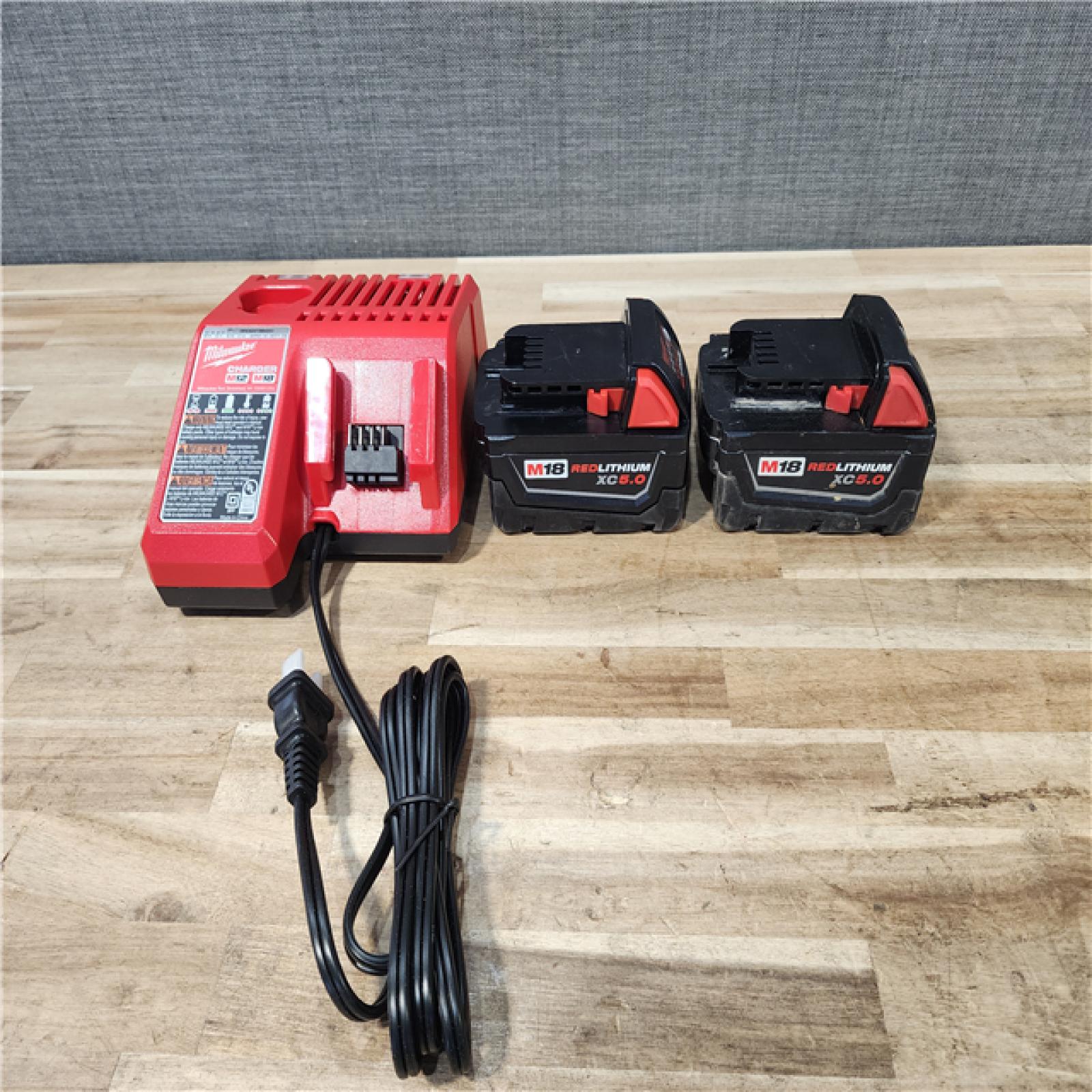 HOUSTON LOCATION - AS-IS MILWAUKEE 2 TOOL COMBO KIT W/ (2) BATTERY & CHARGER