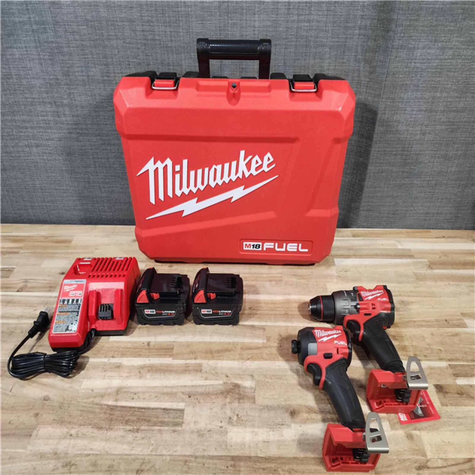 HOUSTON LOCATION - AS-IS (APPEARS LIKE NEW) Milwaukee  FUEL 18V Lithium-Ion Brushless Cordless Hammer Drill and Impact Driver Combo Kit