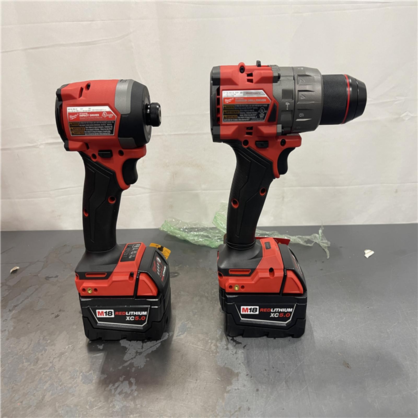 AS-IS - Milwaukee M18 FUEL 18V Lithium-Ion Brushless Cordless Hammer Drill and Impact Driver Combo Kit (2-Tool) with 2 Batteries
