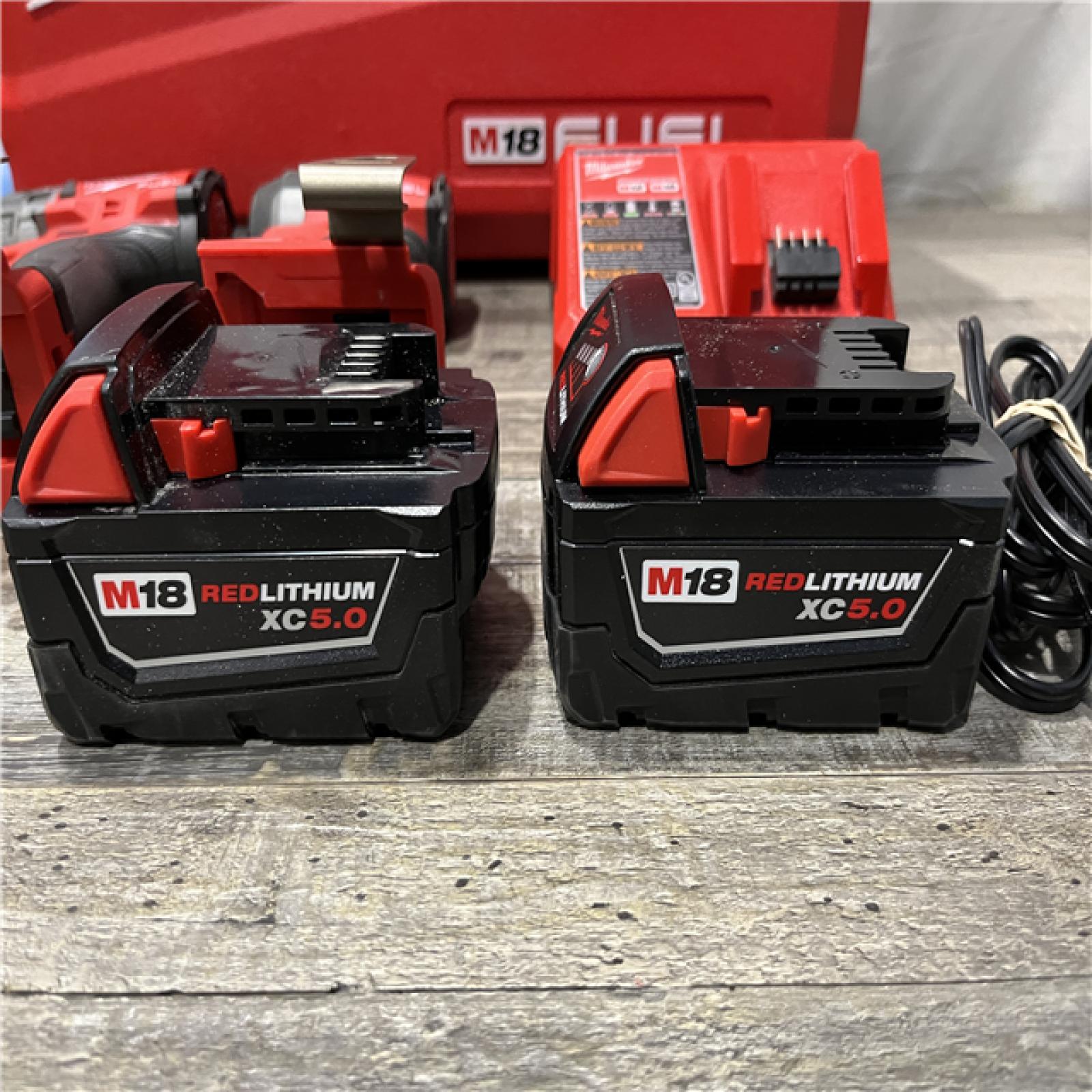 AS-IS Milwaukee FUEL 18V Lithium-Ion Brushless Cordless Hammer Drill and Impact Driver Combo Kit