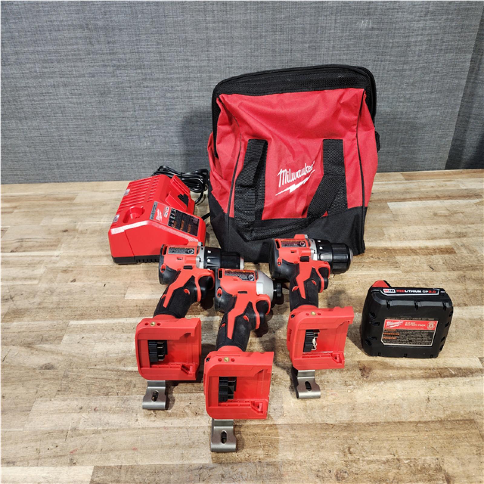 Houston Location AS-IS Milwaukee Drills Hammer/Driver QTY/2 and impact Driver and Battery with Charger