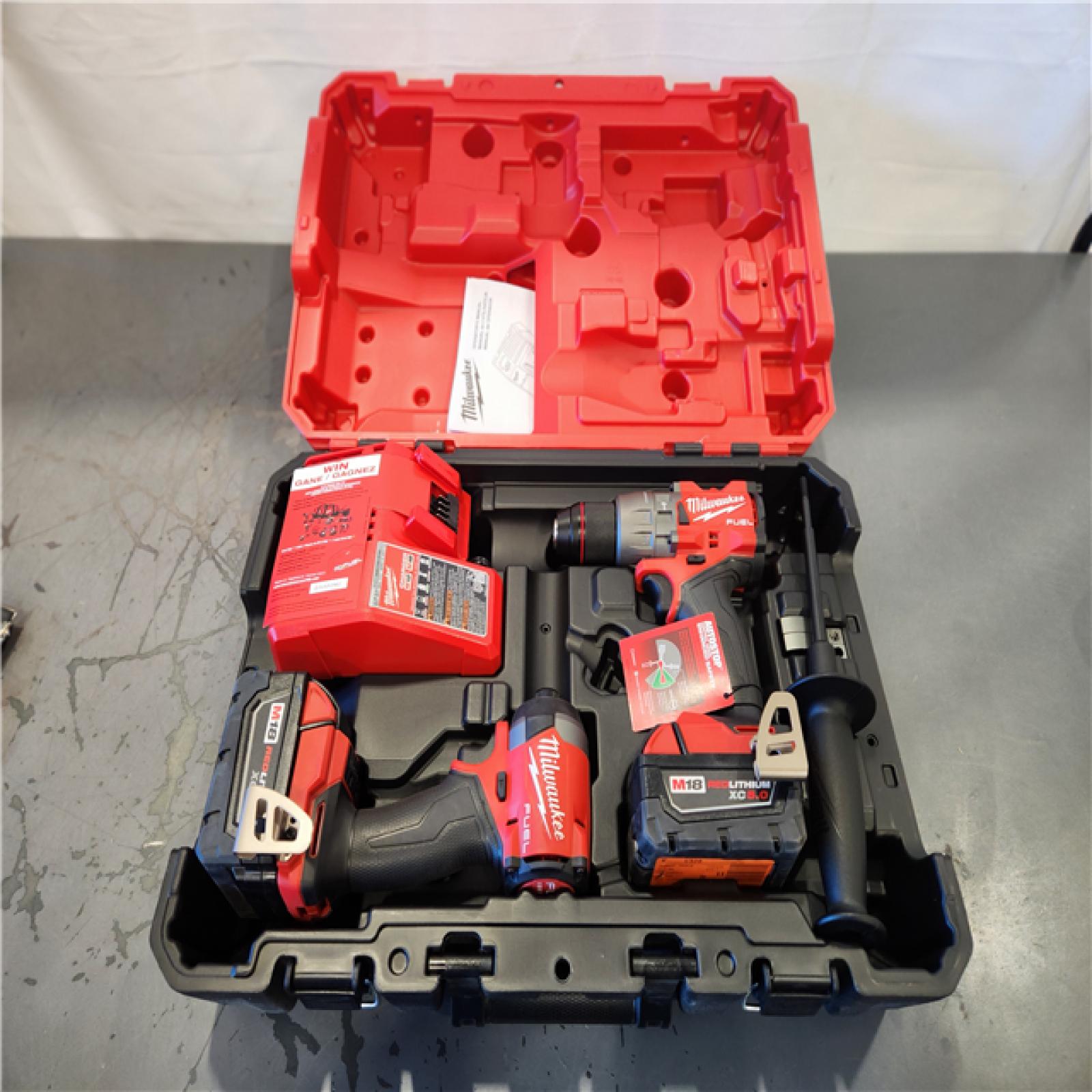 AS-IS - Milwaukee M18 FUEL 18V Lithium-Ion Brushless Cordless Hammer Drill and Impact Driver Combo Kit (2-Tool) with 2 Batteries