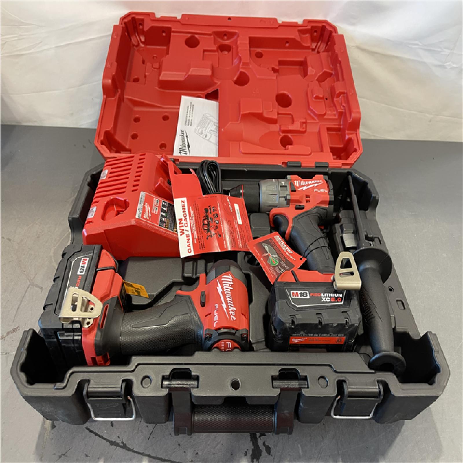AS-IS - Milwaukee M18 FUEL 18V Lithium-Ion Brushless Cordless Hammer Drill and Impact Driver Combo Kit