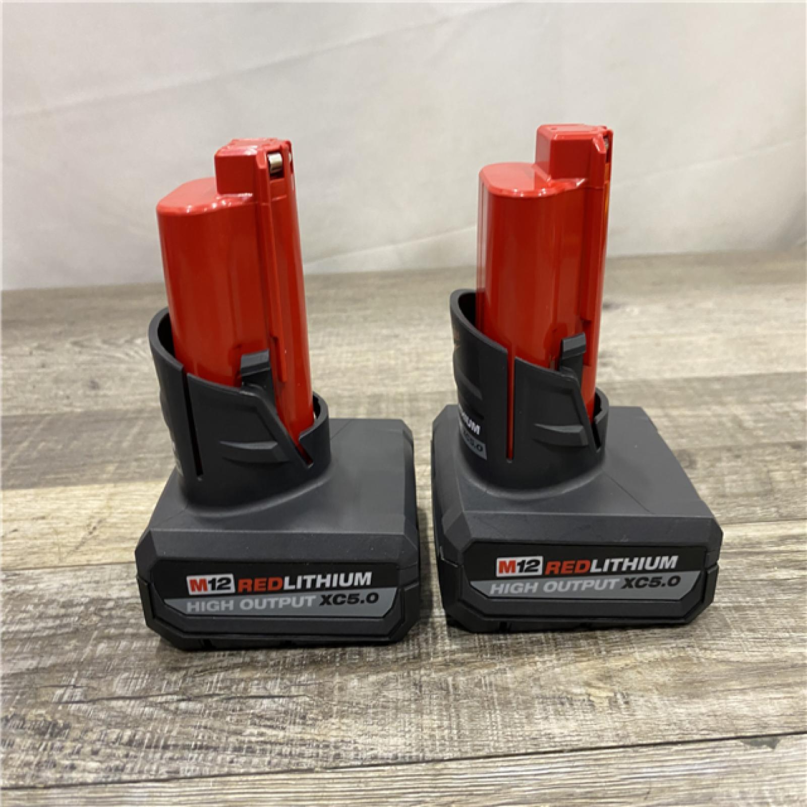 AS-IS Milwaukee 12V Lithium-Ion XC High Output 5.0 Ah Battery Pack (2-Pack) Starter Kit with Charger