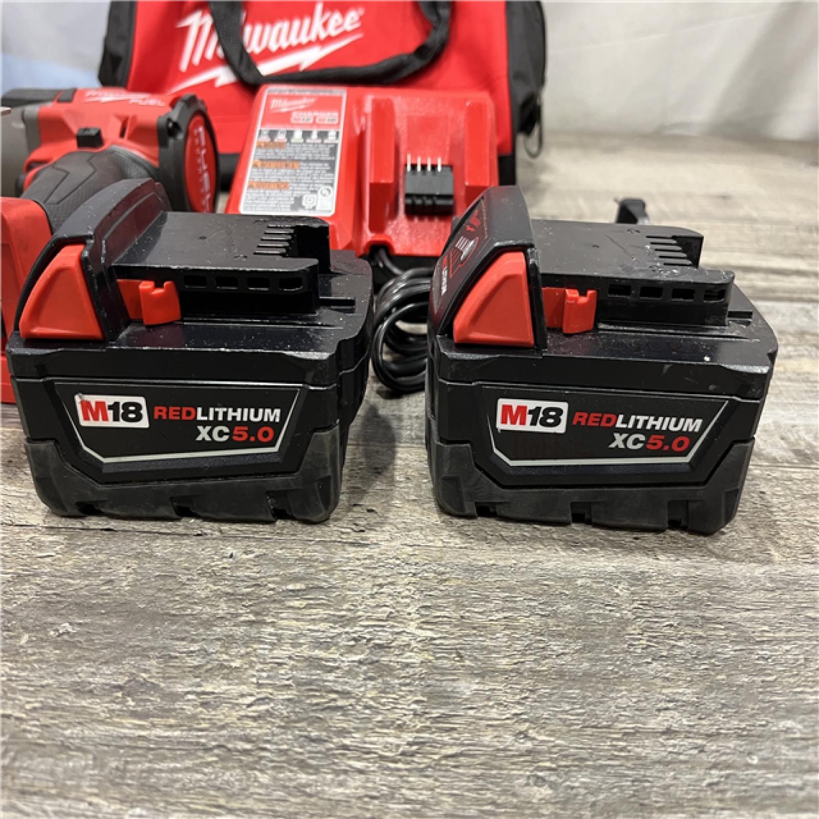 AS-IS Milwaukee FUEL 18V Lithium-Ion Brushless Cordless 1/2 in. Mid-Torque Impact Wrench with Friction Ring Kit