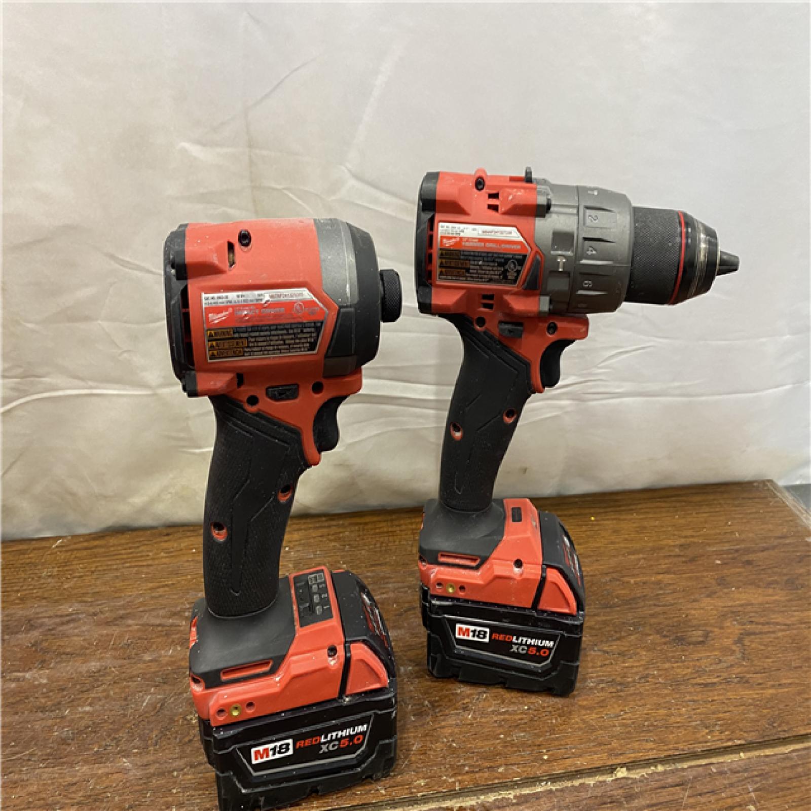 AS-IS MILWAUKEE M18 FUEL 18V Lithium-Ion Brushless Cordless Hammer Drill and Impact Driver Combo Kit (2-Tool) with 2 Batteries