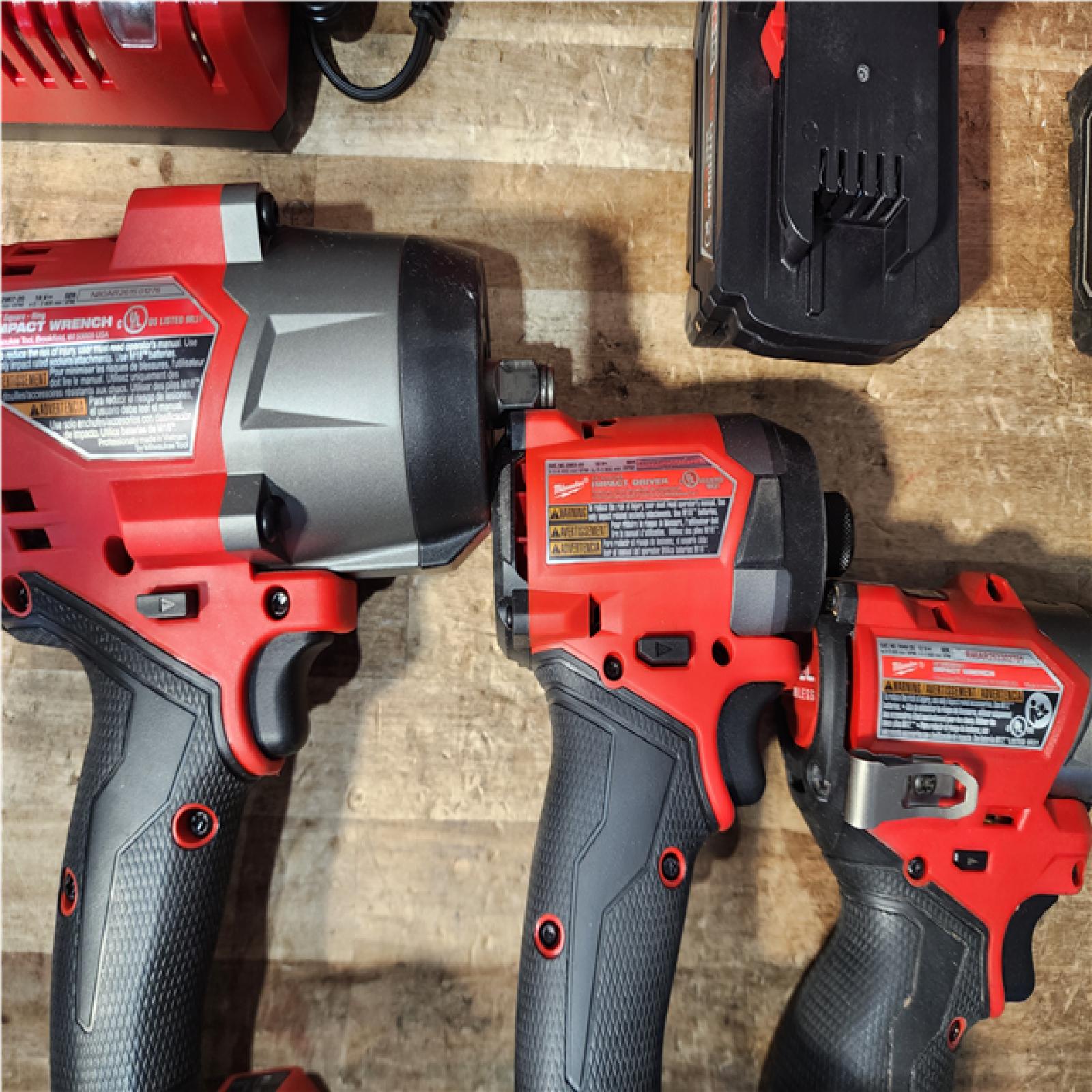 Houston Location AS-IS Milwaukee Impact Drivers QTY/2 and Impact Wrench and Batteries QTY/2 with Charger