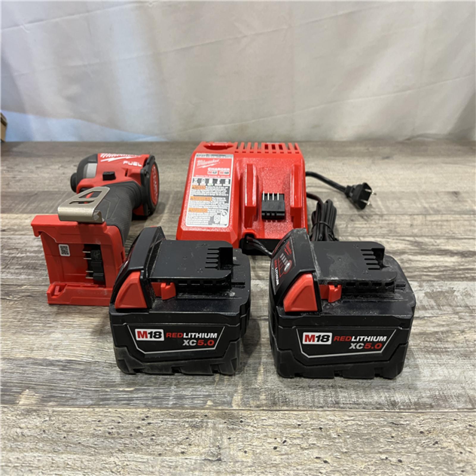 AS-IS Milwaukee FUEL 18V Lithium-Ion Brushless Cordless 1/4 in. Hex Impact Driver Kit