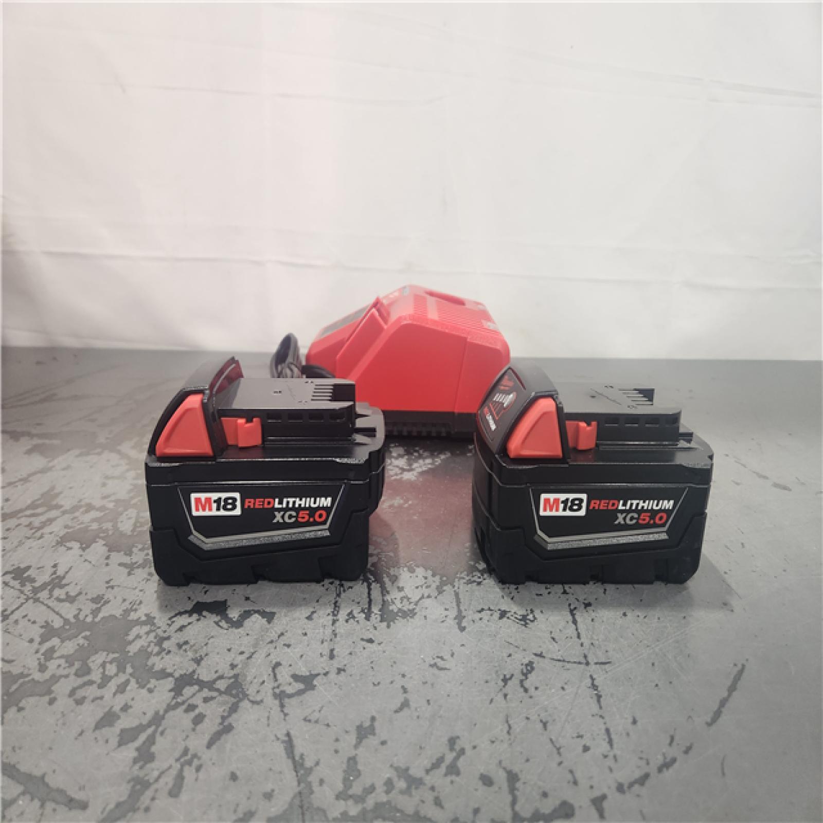 AS-IS- Milwaukee 18-Volt Lithium-Ion XC Starter Kit with Two 5.0Ah Batteries and Charger