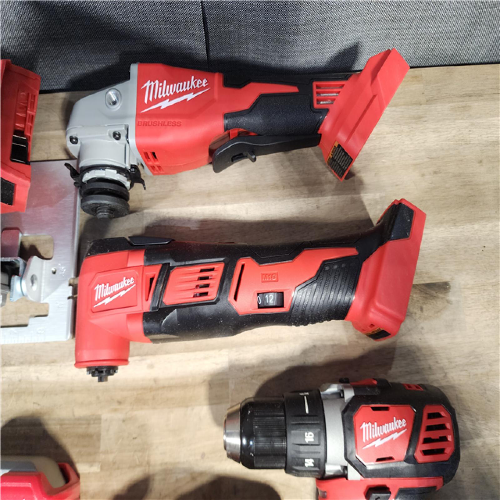 HOUSTON LOCATION - AS-IS MILWAUKEE 7 TOOL COMBO KIT W/ (2) BATTERY & CHARGER
