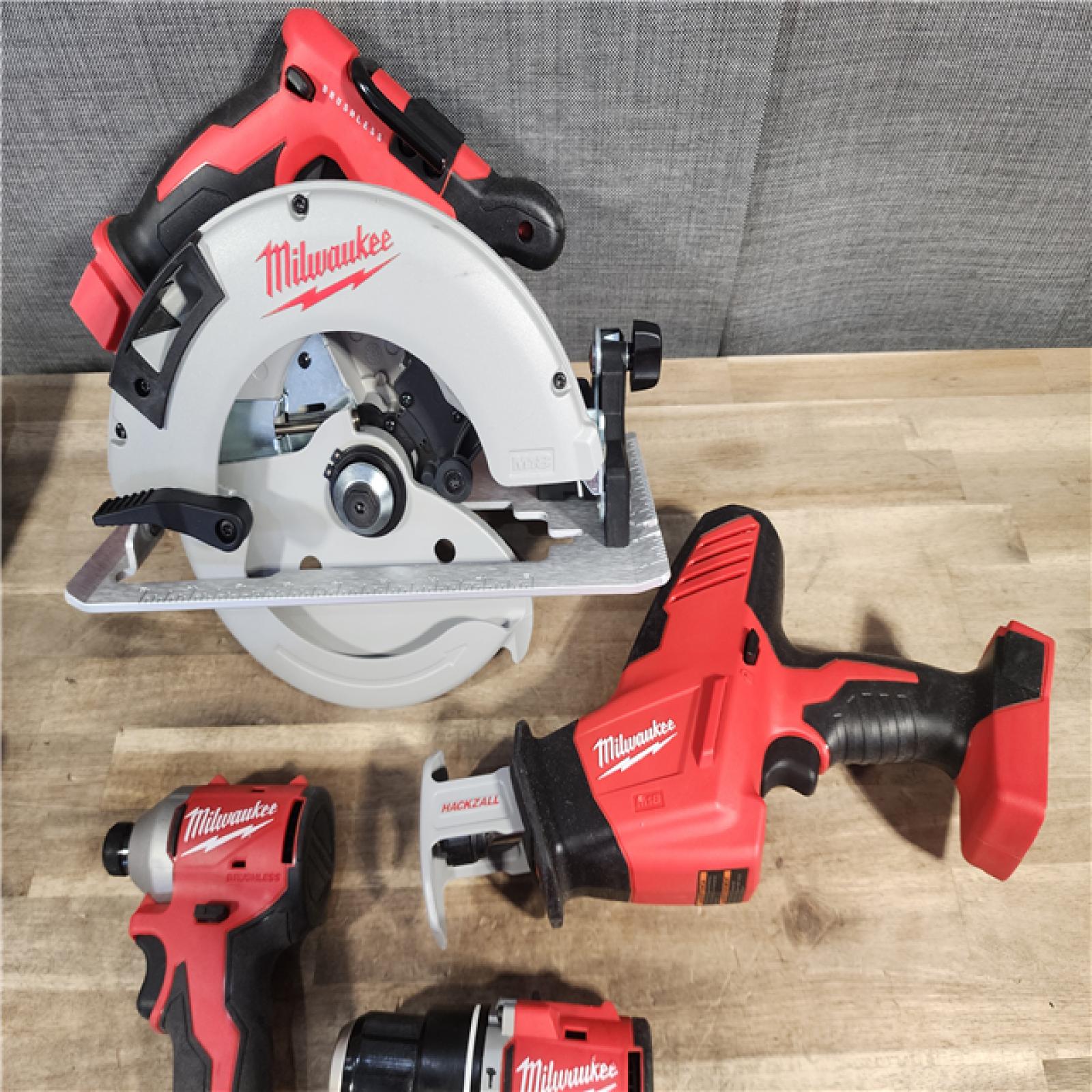 HOUSTON LOCATION - AS-IS Milwaukee M18 18-Volt Lithium-Ion Brushless Cordless Combo Kit (4-Tool) with 2-Batteries, 1-Charger and Tool Bag