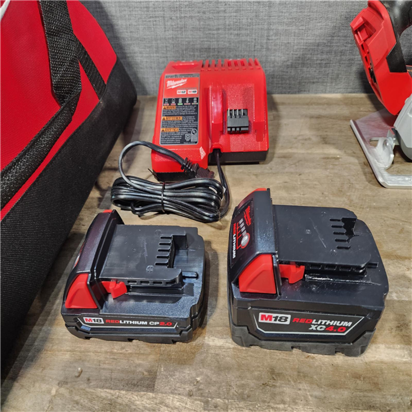 HOUSTON LOCATION - AS-IS Milwaukee M18 18-Volt Lithium-Ion Brushless Cordless Combo Kit (4-Tool) with 2-Batteries  1-Charger and Tool Bag