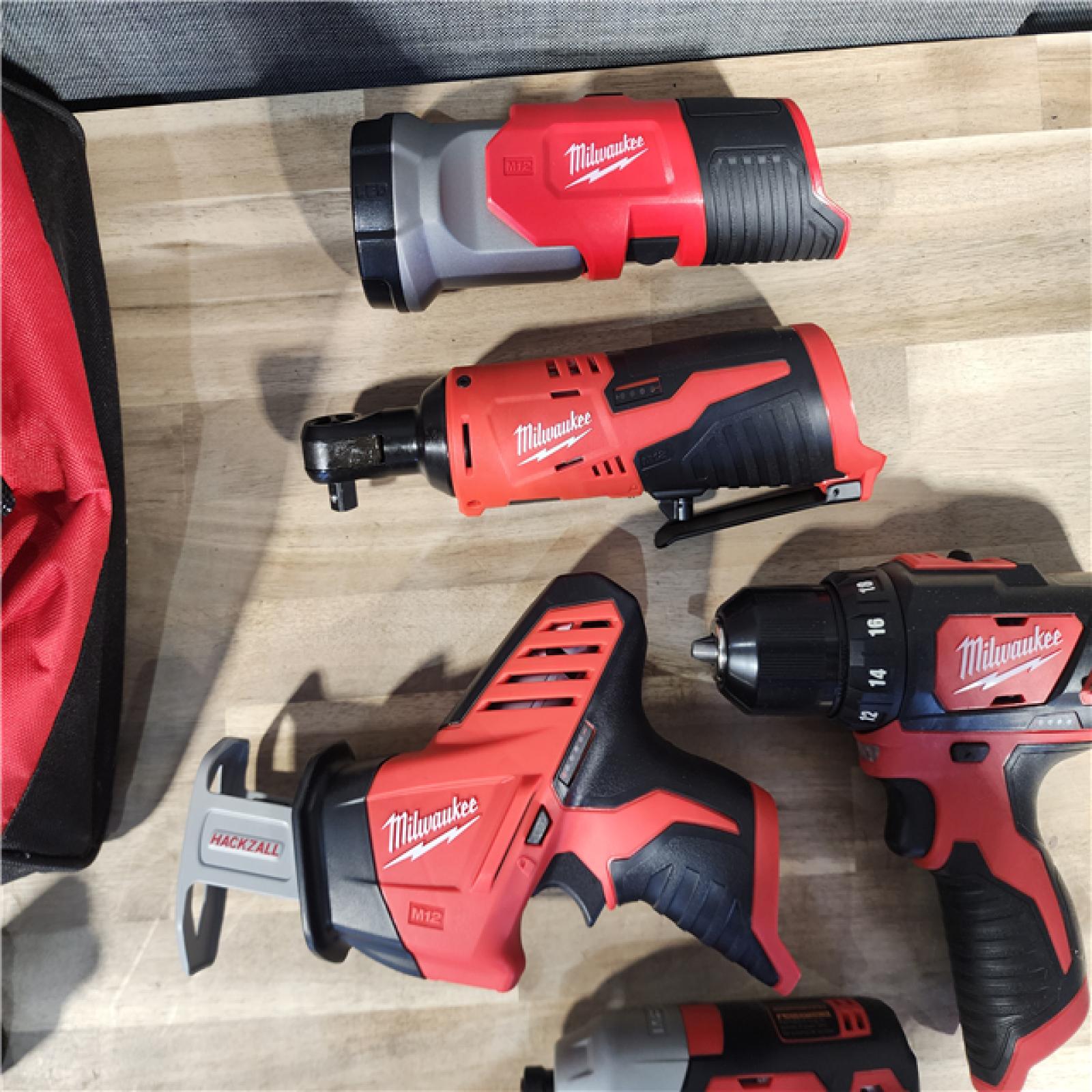 HOUSTON LOCATION - AS-IS (APPEARS LIKE NEW) MILWAUKEE M12 12V Lithium-Ion Cordless Combo Kit (5-Tool) with Two 1.5Ah Batteries, Charger & Tool Bag