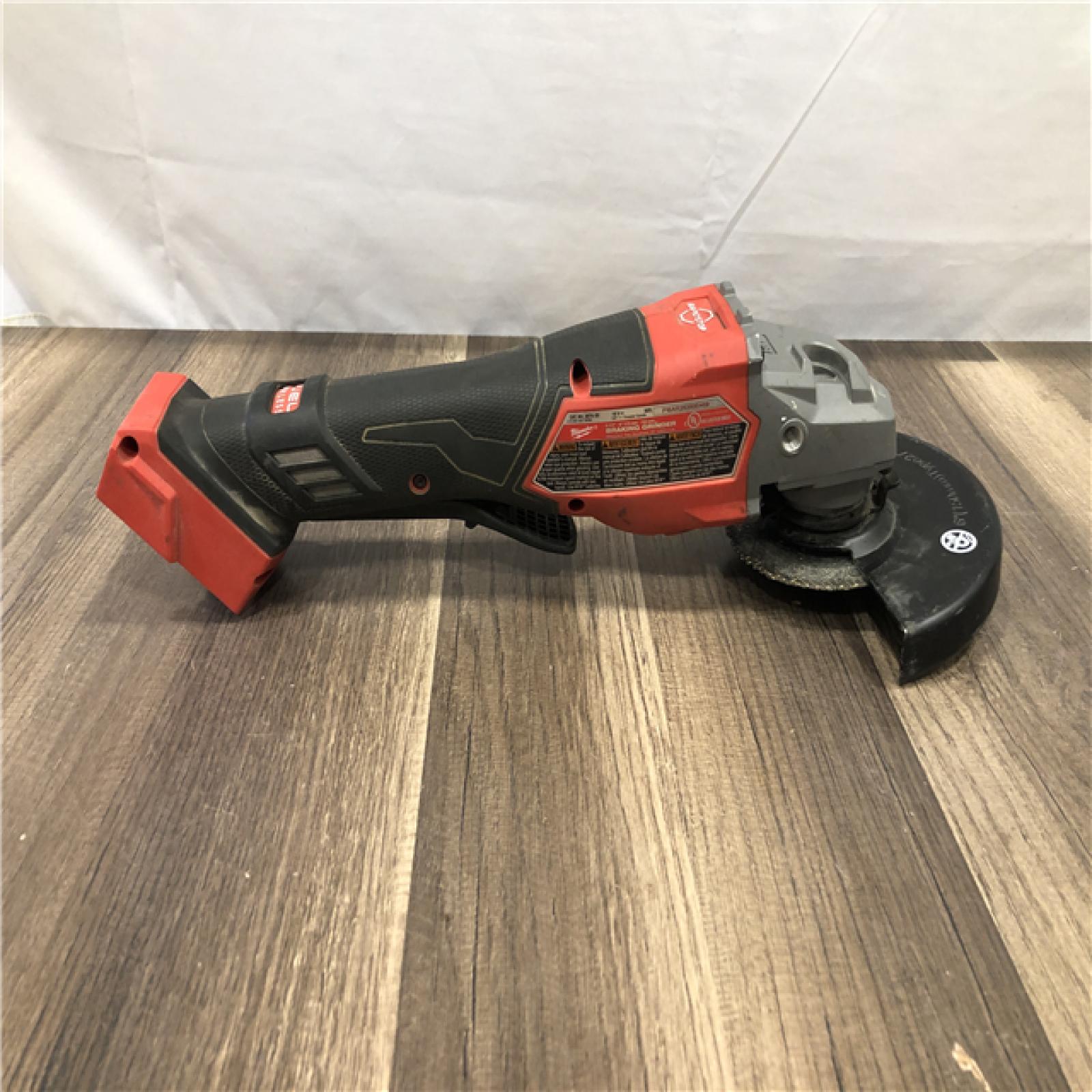 AS-IS Milwaukee  FUEL 18-Volt Lithium-Ion Brushless Cordless 4-1/2 in./6 in. Braking Grinder with Paddle Switch (Tool-Only)
