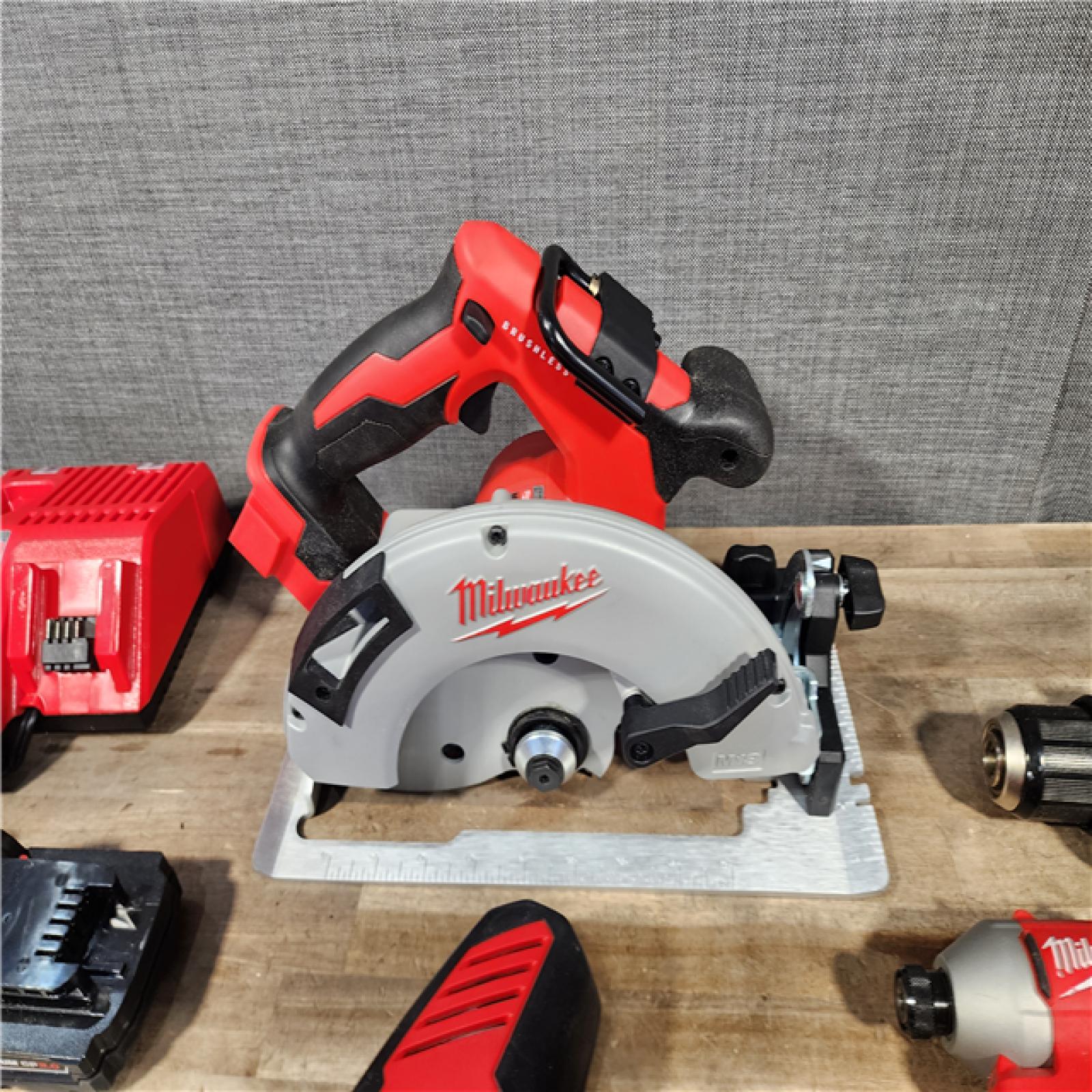 HOUSTON LOCATION - AS-IS Milwaukee M18 18-Volt Lithium-Ion Brushless Cordless Combo Kit (4-Tool) with 2-Batteries  1-Charger and Tool Bag