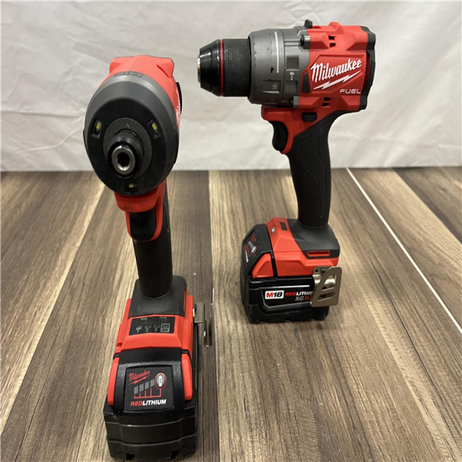 AS-IS MILWAUKEE FUEL 18V Lithium-Ion Brushless Cordless Hammer Drill and Impact Driver Combo Kit (2-Tool) with 2 Batteries