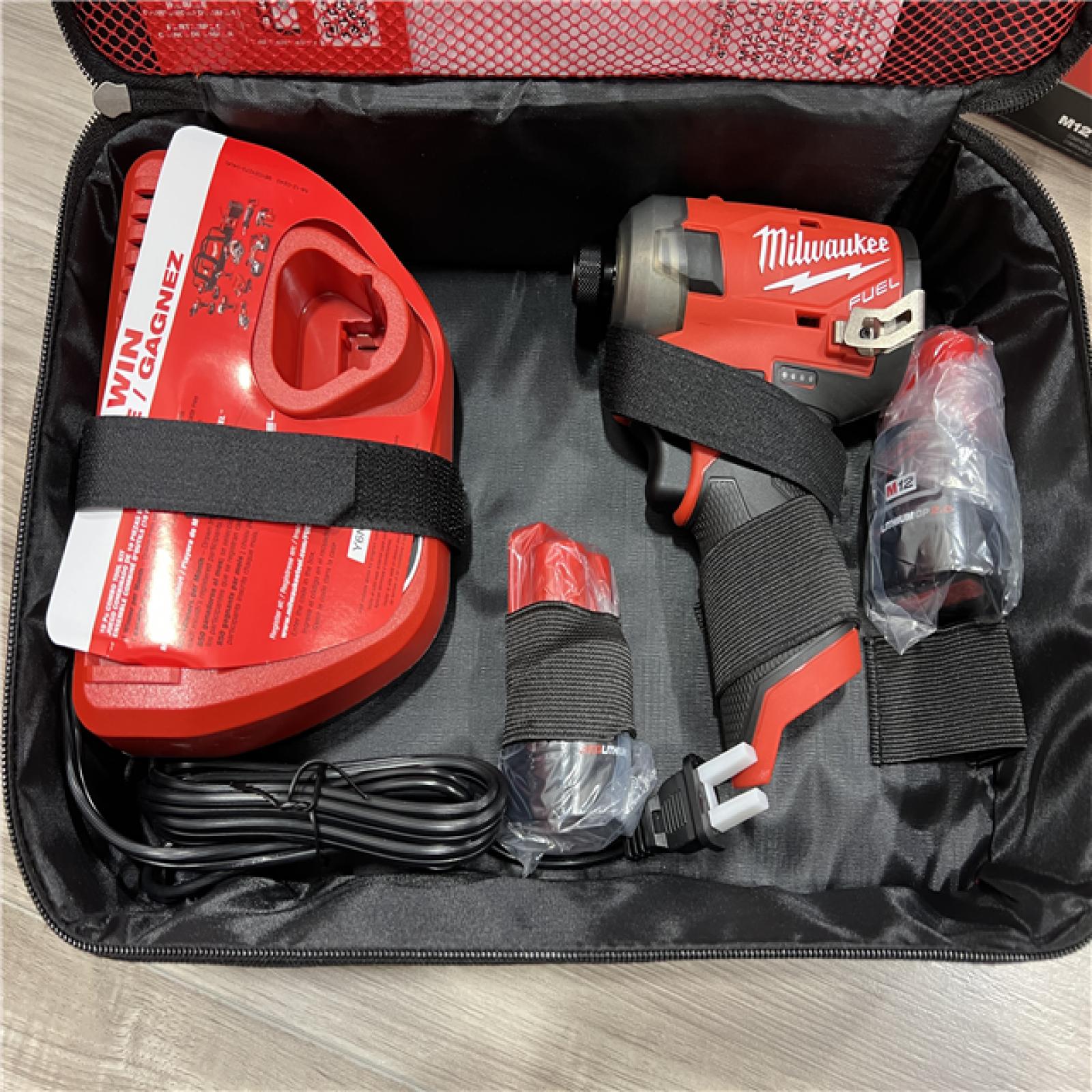AS-IS Milwaukee FUEL SURGE 12V Lithium-Ion Brushless Cordless 1/4 in. Hex Impact Driver Compact Kit