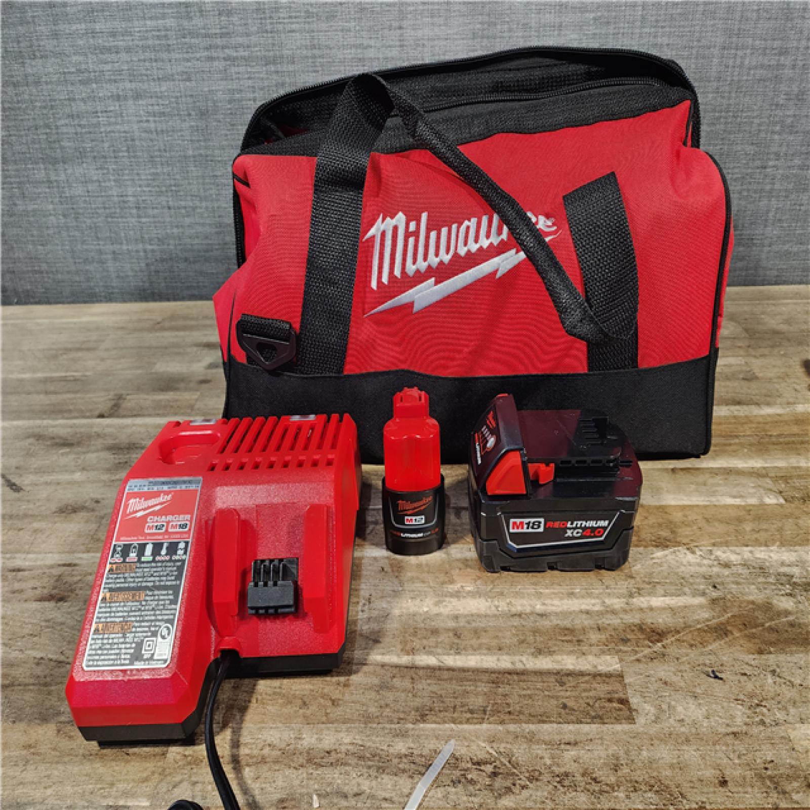 HOUSTON LOCATION - AS-IS Milwaukee 12/18V Lithium-Ion Cordless 3/8 in. Ratchet and 1/2 in. High Torque Impact Wrench with Friction Ring Combo Kit