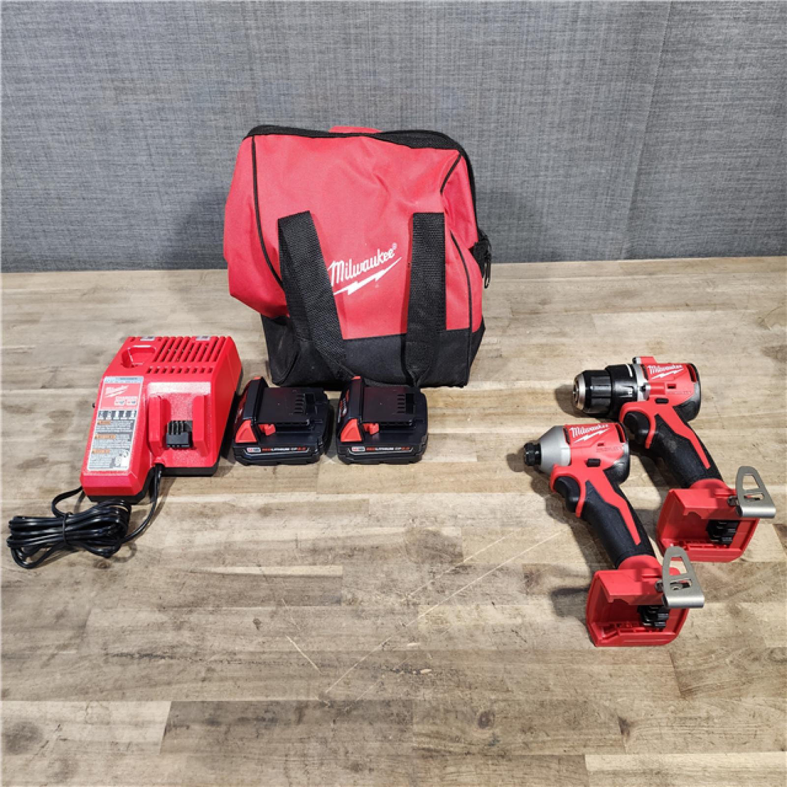 HOUSTON LOCATION - AS-IS Milwaukee M18 18V Lithium-Ion Brushless Cordless Compact Drill/Impact Combo Kit (2-Tool) W/(2) 2.0 Ah Batteries, Charger & Bag