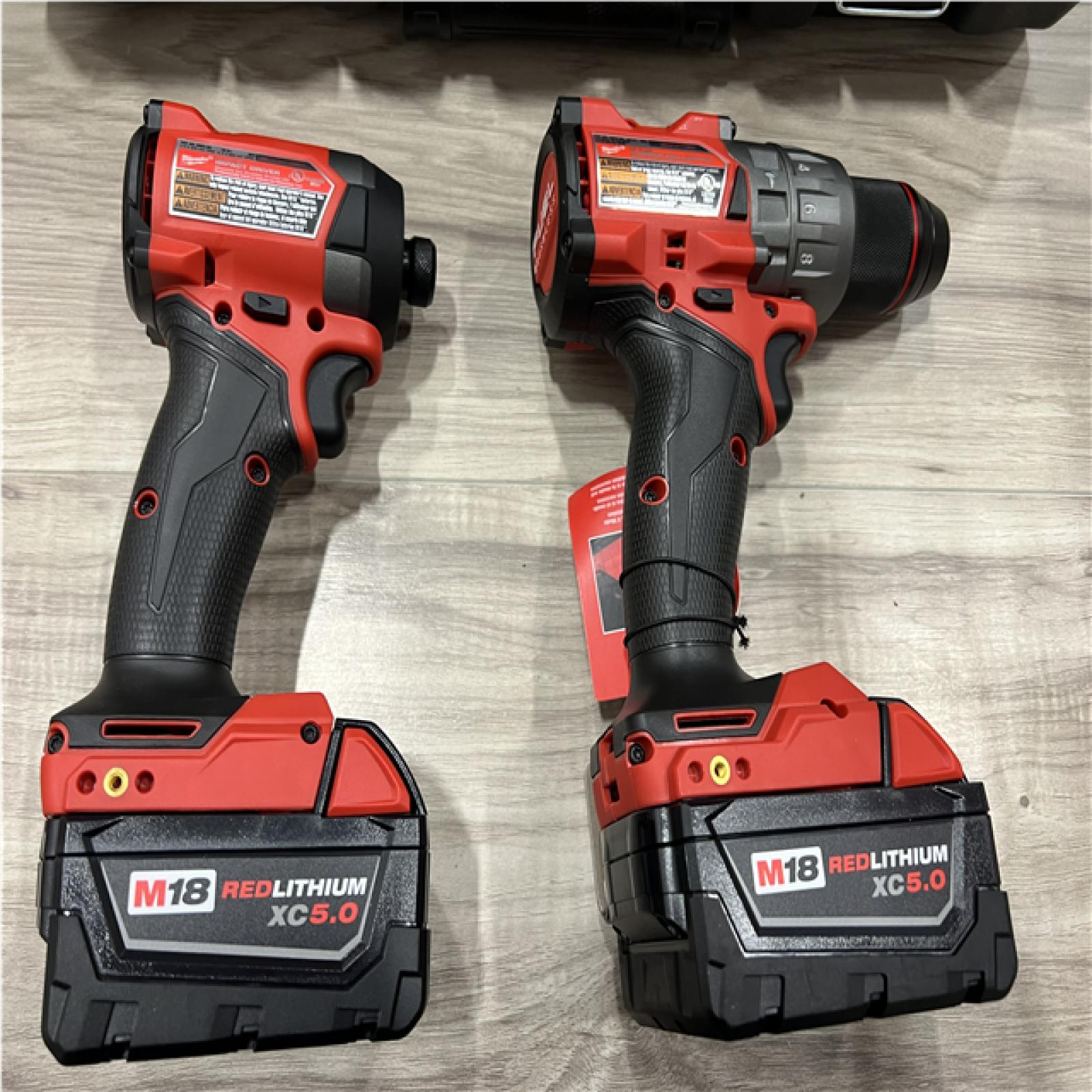AS-IS Milwaukee FUEL 18V Lithium-Ion Brushless Cordless Hammer Drill and Impact Driver Combo Kit