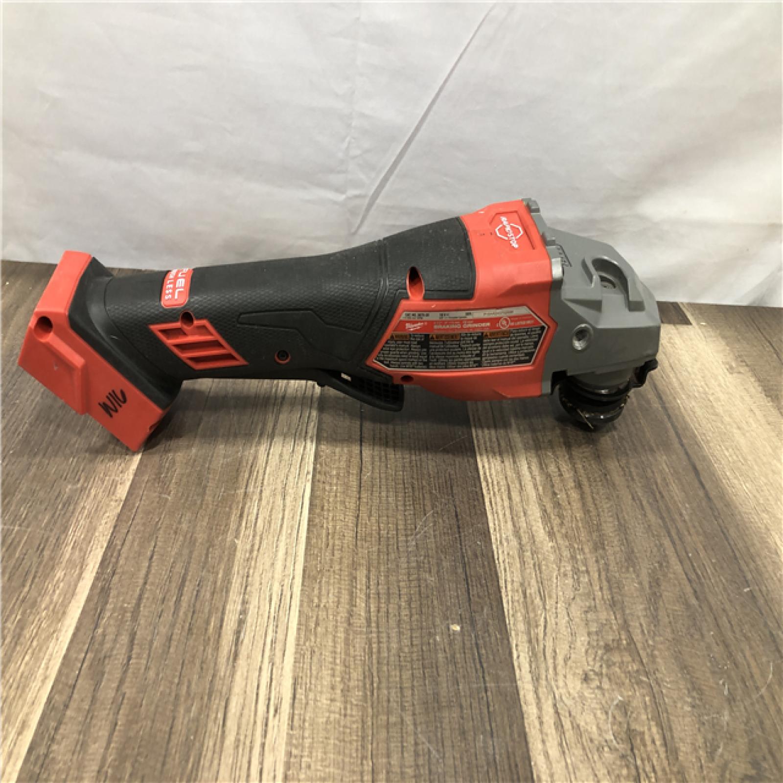 AS-IS Milwaukee  FUEL 18-Volt Lithium-Ion Brushless Cordless 4-1/2 in./6 in. Braking Grinder with Paddle Switch (Tool-Only)
