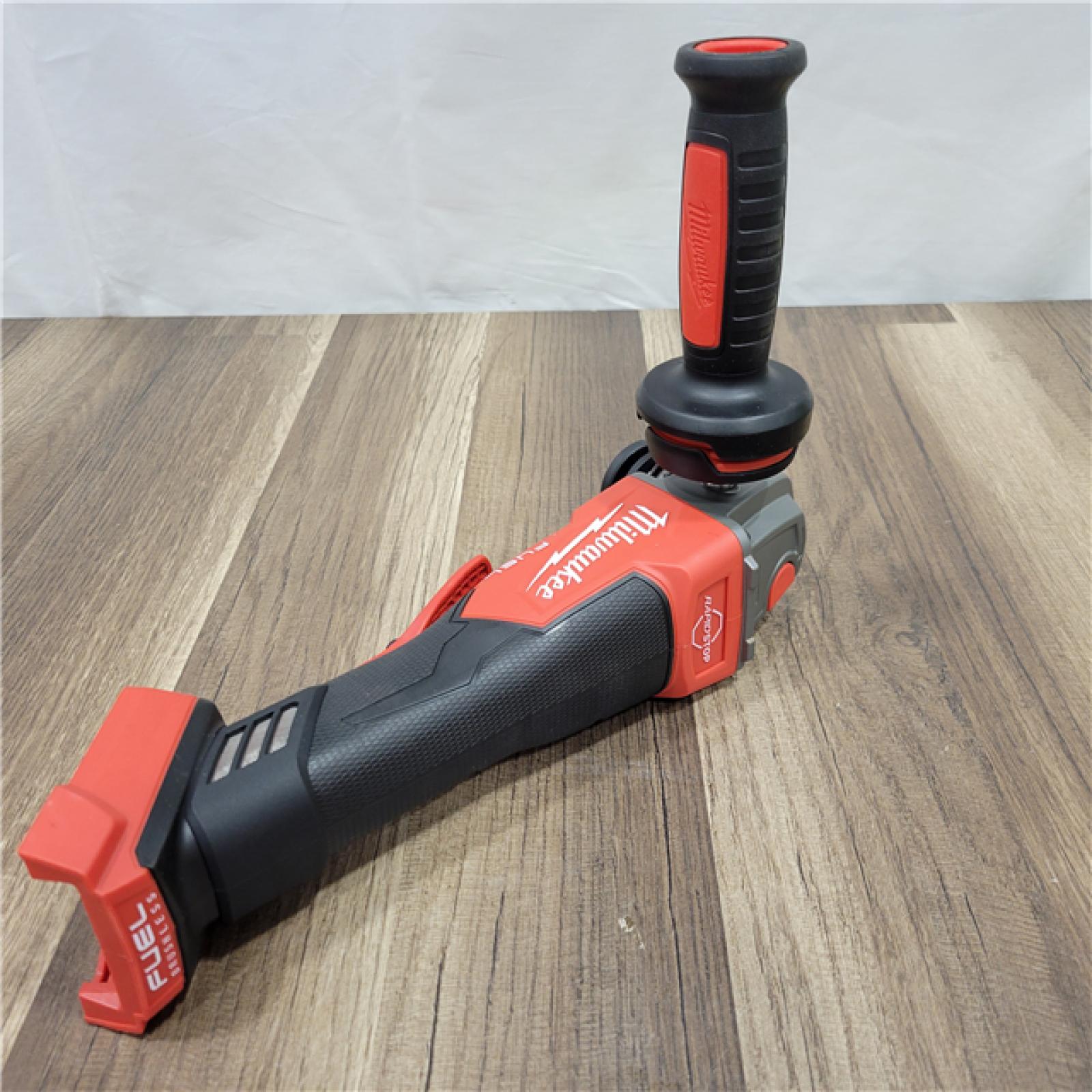 AS-IS Milwaukee  M18 FUEL 18-Volt Lithium-Ion Brushless Cordless 4-1/2 in./5 in. Grinder W/Paddle Switch (Tool-Only)
