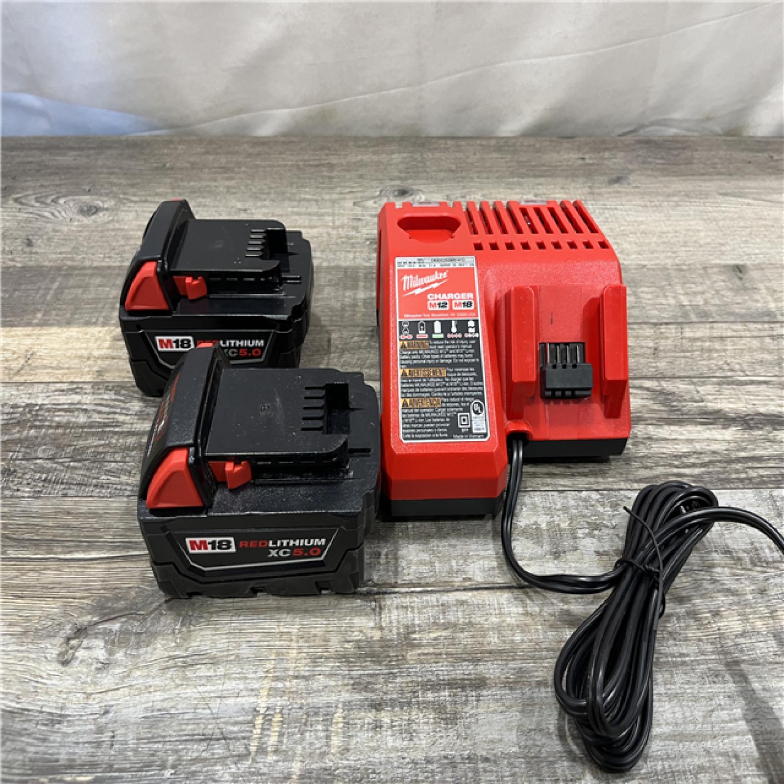 AS-IS Milwaukee 18-Volt Lithium-Ion XC Starter Kit with (2) 5.0Ah Batteries and Charger