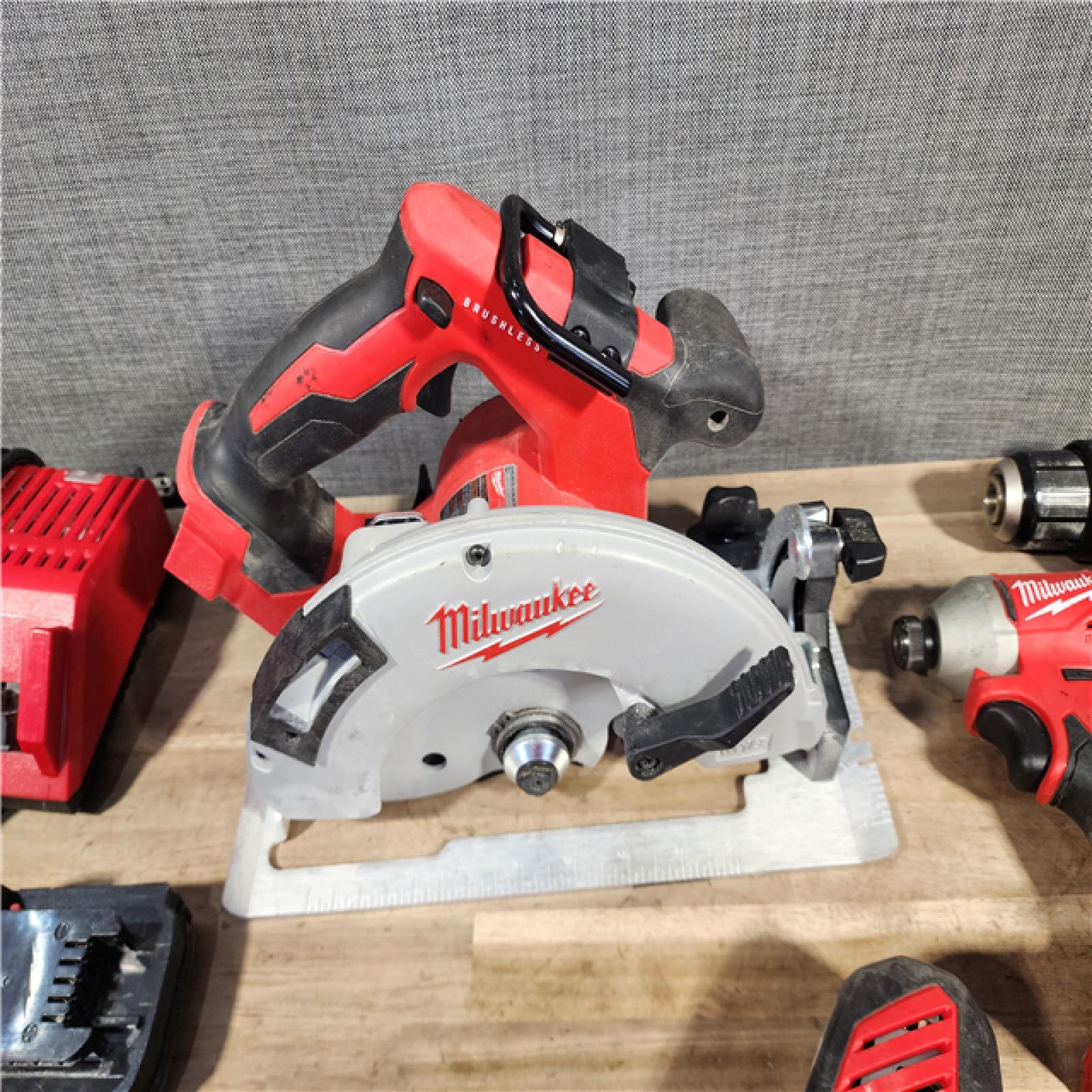 HOUSTON LOCATION - AS-IS Milwaukee M18 18-Volt Lithium-Ion Brushless Cordless Combo Kit (4-Tool) with 2-Batteries, 1-Charger and Tool Bag
