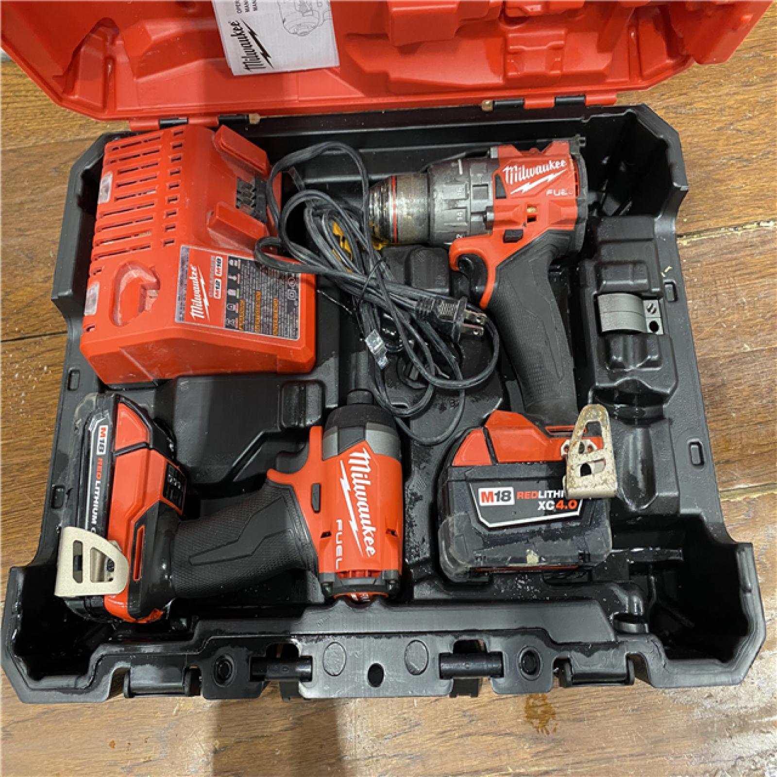 AS-IS MILWAUKEE M18 FUEL 18V Lithium-Ion Brushless Cordless Hammer Drill and Impact Driver Combo Kit (2-Tool) with 2 Batteries