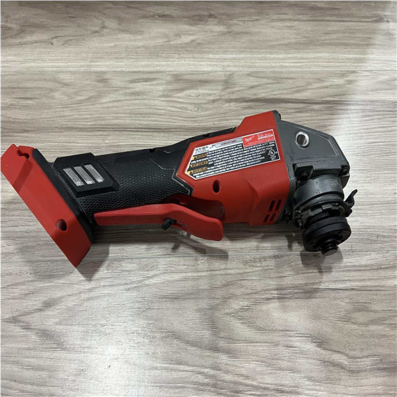AS-IS Milwaukee FUEL 18V Lithium-Ion Brushless Cordless 4-1/2 in./5 in. Grinder w/Paddle Switch (Tool-Only)