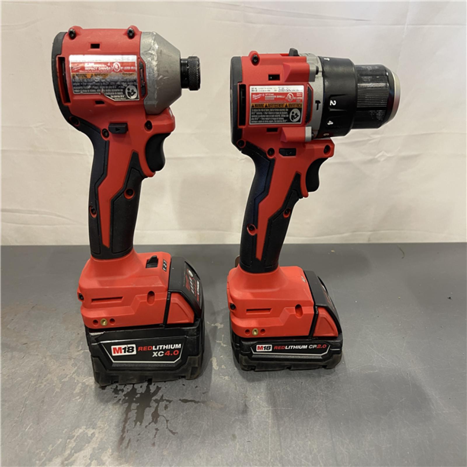 AS-IS - Milwaukee M18 18-Volt Lithium-Ion Brushless Cordless Compact Hammer Drill/Impact Combo Kit