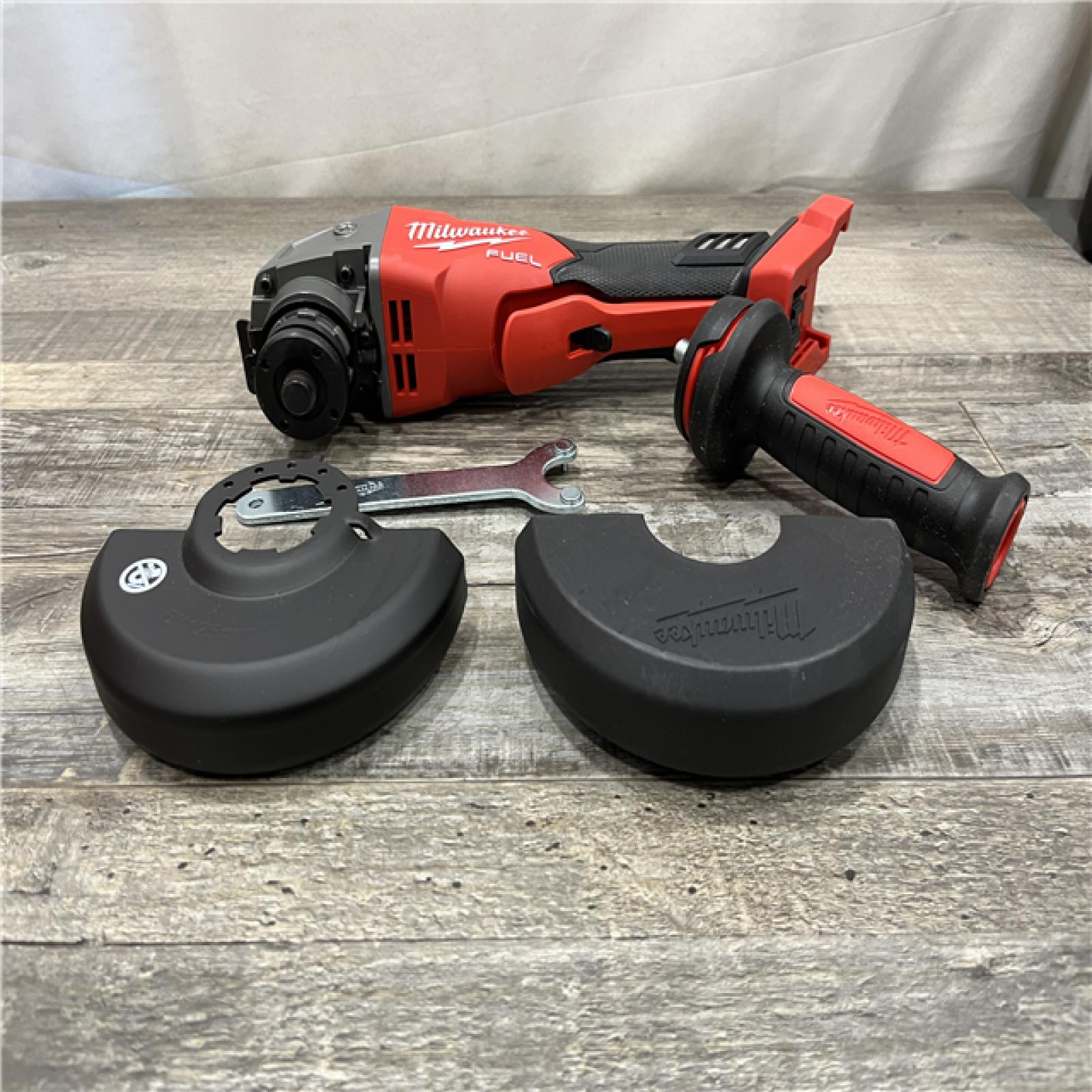 AS-IS Milwaukee FUEL 18V Lithium-Ion Brushless Cordless 4-1/2 in./5 in. Grinder w/Paddle Switch (Tool-Only)