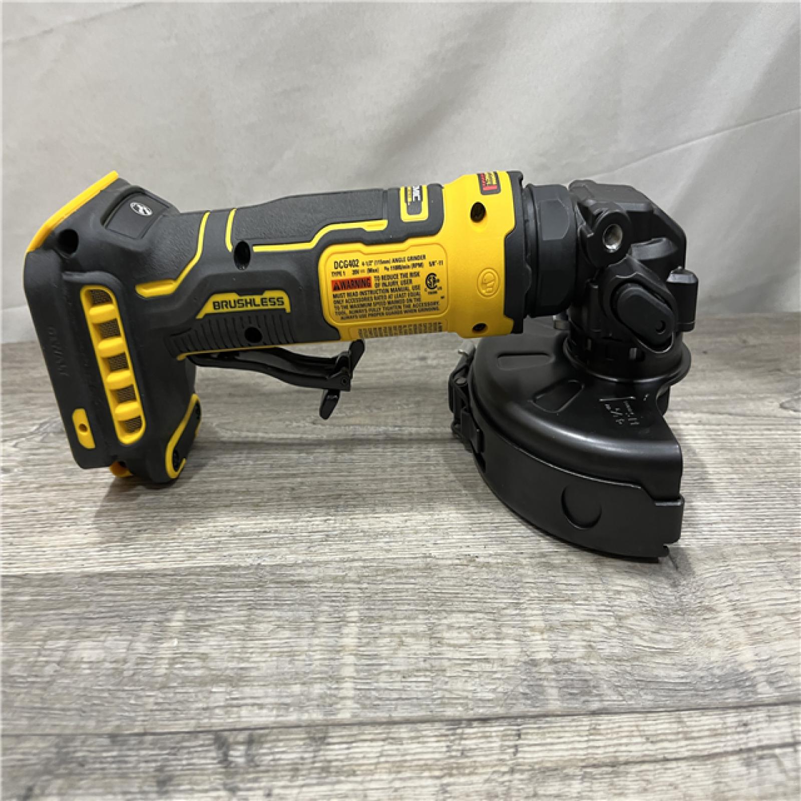 AS-IS DEWALT ATOMIC 20V MAX Cordless 4-1/2 in. Angle Grinder with Paddle Switch (Tool Only)