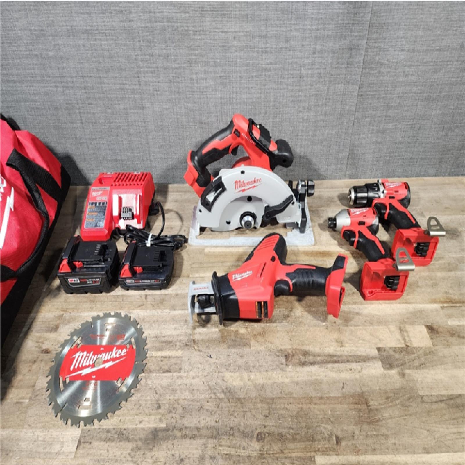 HOUSTON LOCATION - AS-IS Milwaukee M18 18-Volt Lithium-Ion Brushless Cordless Combo Kit (4-Tool) with 2-Batteries, 1-Charger and Tool Bag