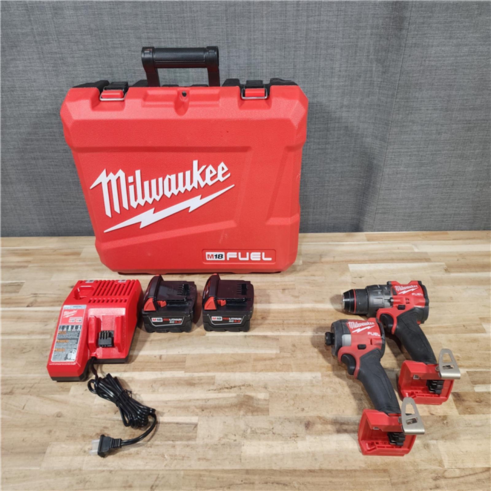 HOUSTON LOCATION - AS-IS Milwaukee FUEL 18V Lithium-Ion Brushless Cordless Hammer Drill and Impact Driver Combo Kit