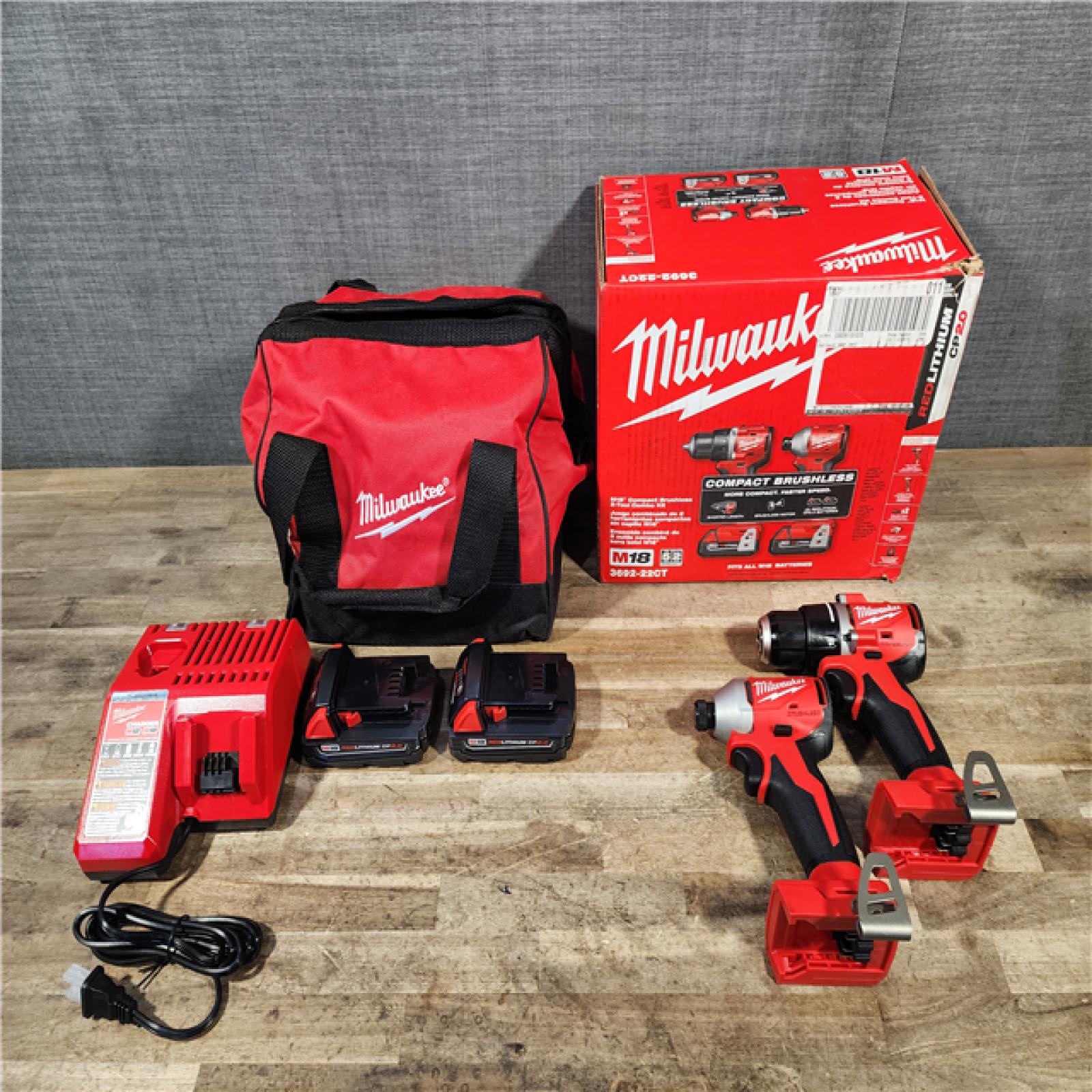 HOUSTON LOCATION - AS-IS Milwaukee M18 18V Lithium-Ion Brushless Cordless Compact Drill/Impact Combo Kit (2-Tool) W/(2) 2.0 Ah Batteries  Charger & Bag