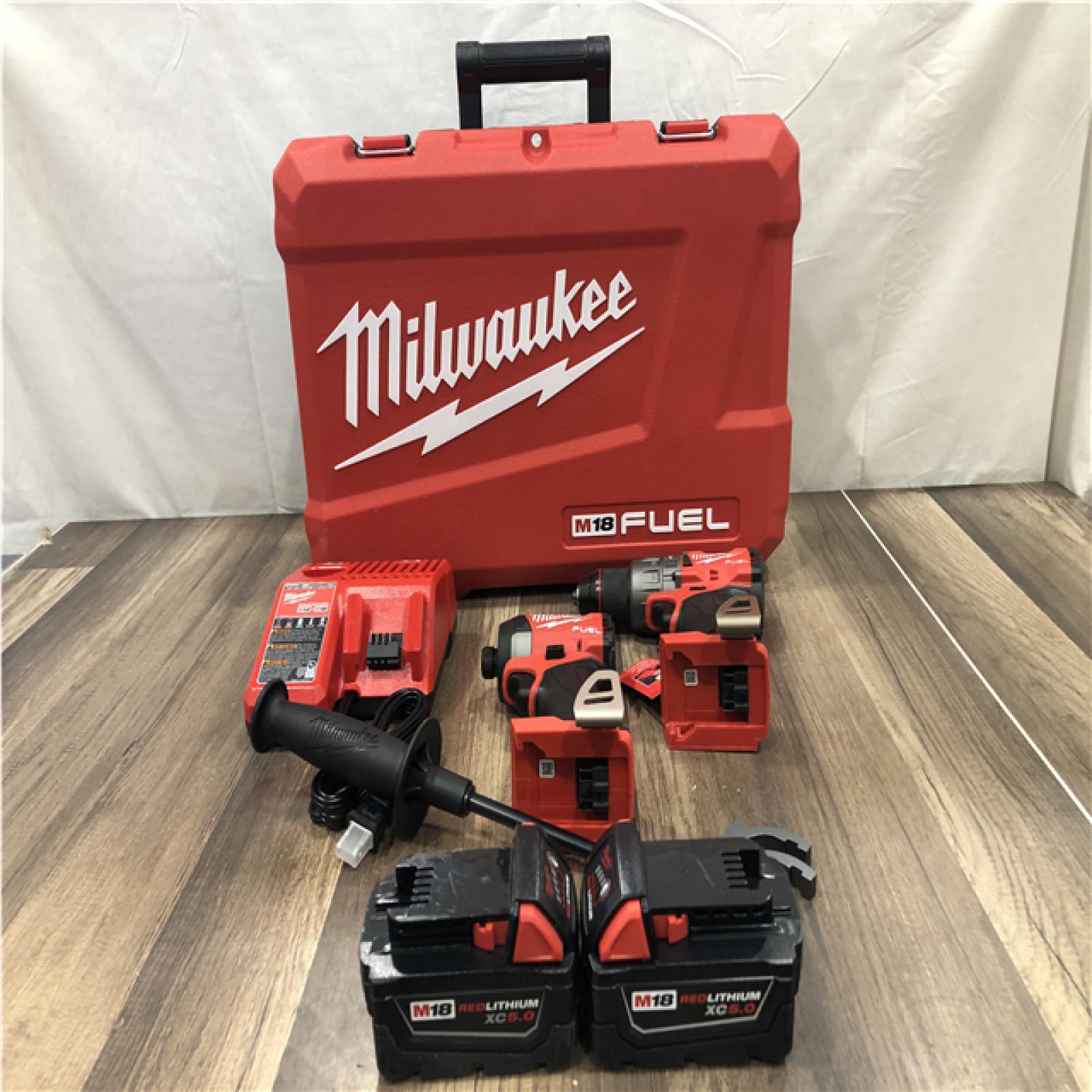 AS-IS Milwaukee FUEL 18V Lithium-Ion Brushless Cordless Hammer Drill and Impact Driver Combo Kit