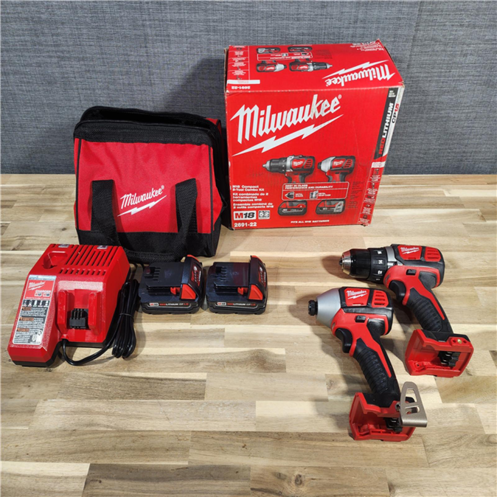 HOUSTON LOCATION - AS-IS Milwaukee M18 18V Cordless Brushed 2 Tool Drill/Driver and Impact Driver Kit
