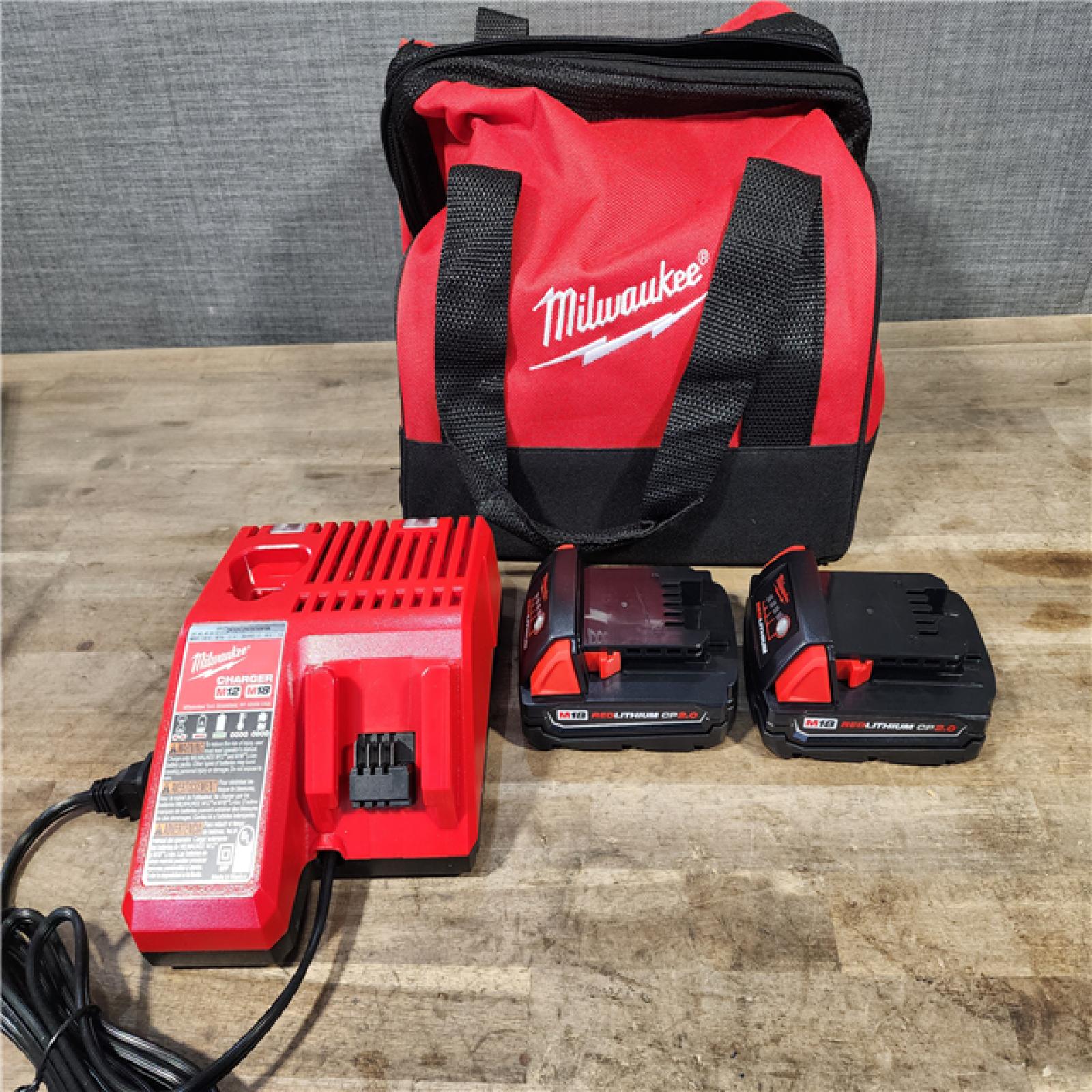 HOUSTON LOCATION - AS-IS Milwaukee M18 18V Lithium-Ion Brushless Cordless Compact Drill/Impact Combo Kit (2-Tool) W/(2) 2.0 Ah Batteries  Charger & Bag