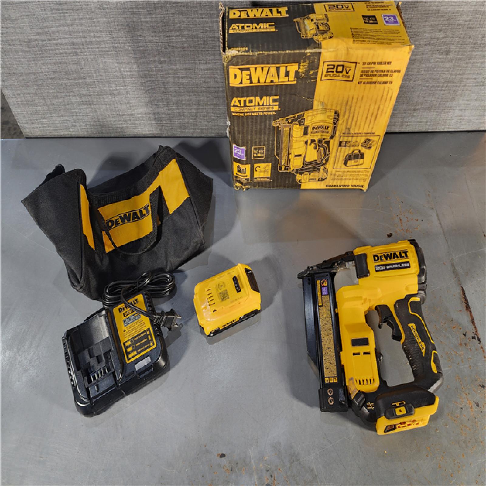 HOUSTON LOCATION - AS-IS (APPEARS LIKE NEW) DEWALT ATOMIC 20V MAX Lithium Ion Cordless 23 Gauge Pin Nailer Kit with 2.0Ah Battery and Charger
