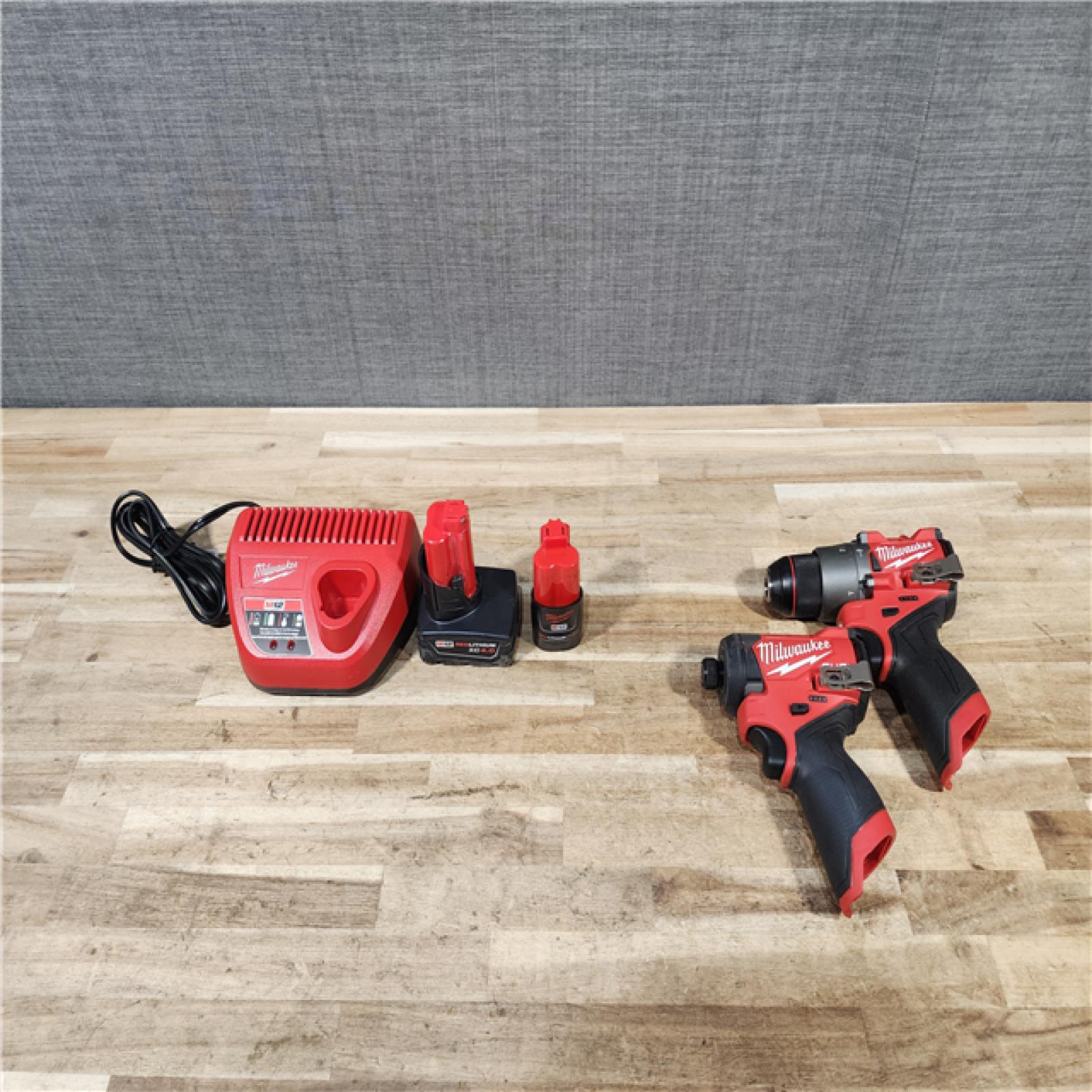 HOUSTON LOCATION - AS-IS Milwaukee FUEL 12-Volt Lithium-Ion Brushless Cordless Hammer Drill and Impact Driver Combo Kit