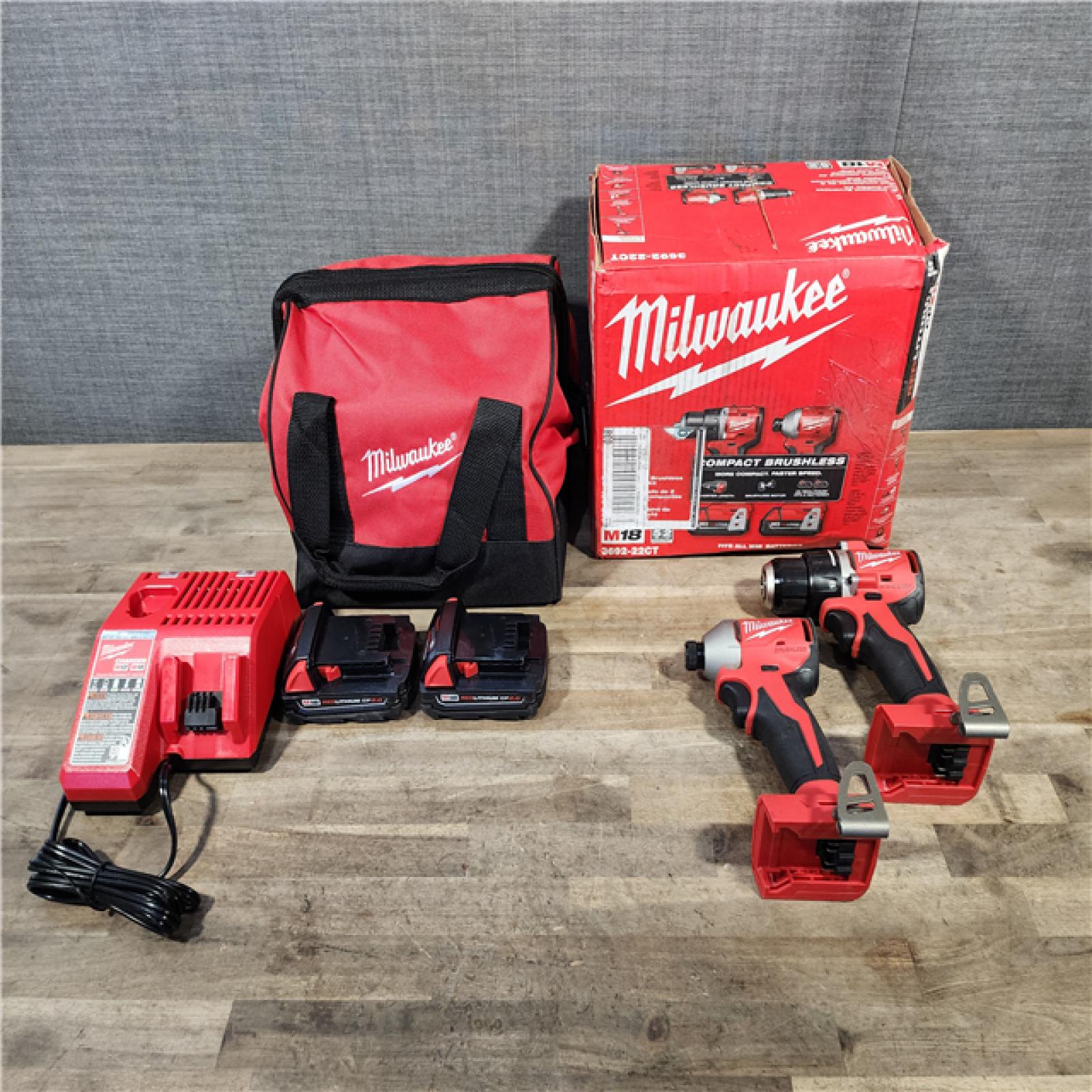 HOUSTON LOCATION - AS-IS Milwaukee M18 18V Lithium-Ion Brushless Cordless Compact Drill/Impact Combo Kit (2-Tool) W/(2) 2.0 Ah Batteries, Charger & Bag