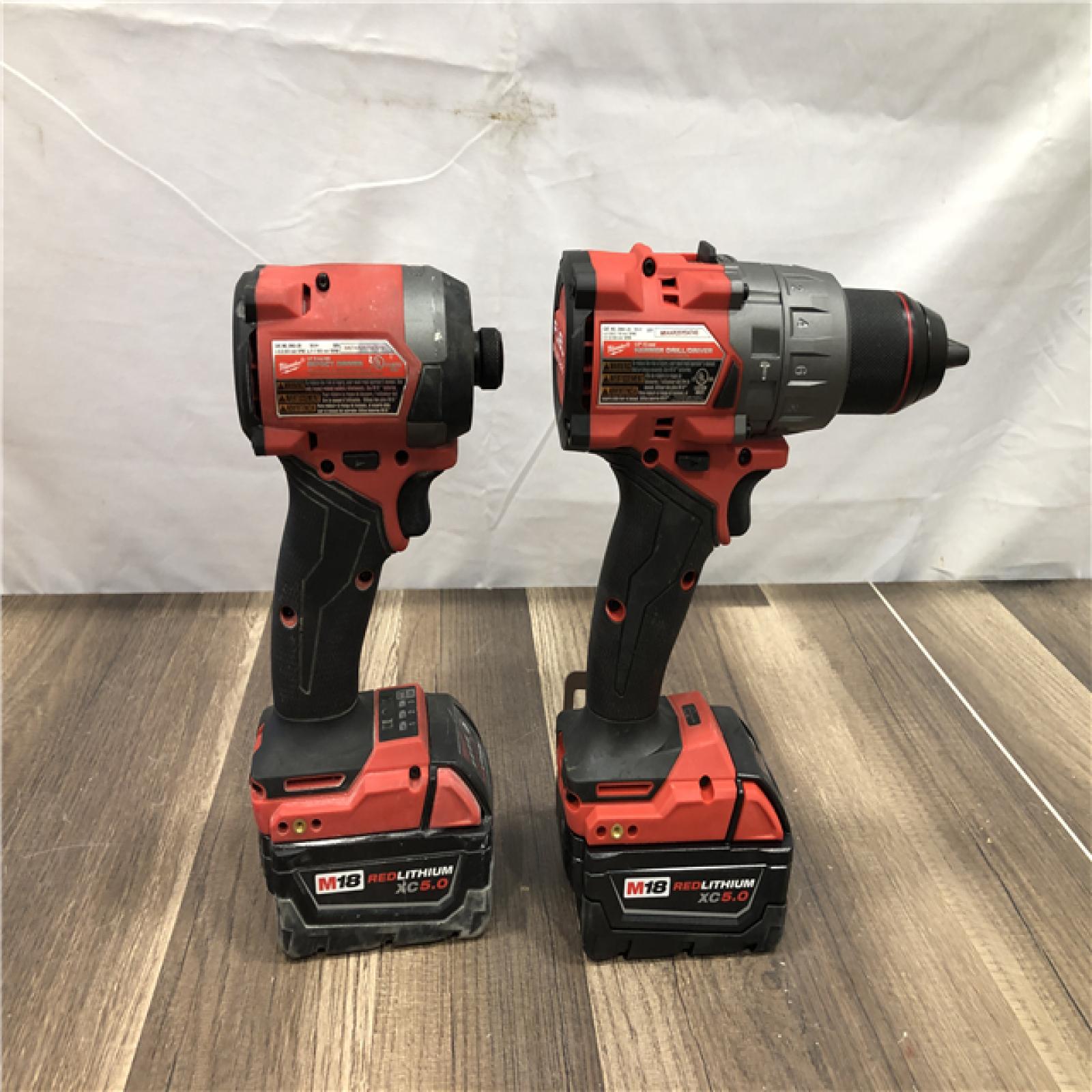 AS-IS Milwaukee FUEL 18V Lithium-Ion Brushless Cordless Hammer Drill and Impact Driver Combo Kit