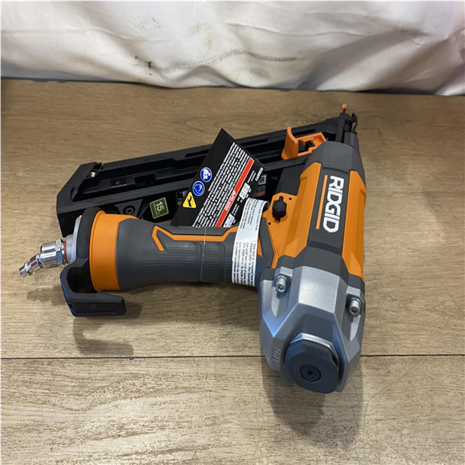 AS-IS Ridgid 15-Gauge 2-1/2 in. Angled Finish Nailer with CLEAN DRIVE Technology  Tool Bag and Sample Nails