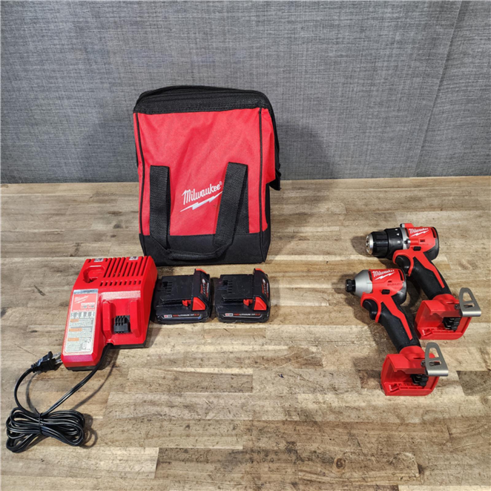 HOUSTON LOCATION - AS-IS Milwaukee M18 18V Lithium-Ion Brushless Cordless Compact Drill/Impact Combo Kit (2-Tool) W/(2) 2.0 Ah Batteries  Charger & Bag