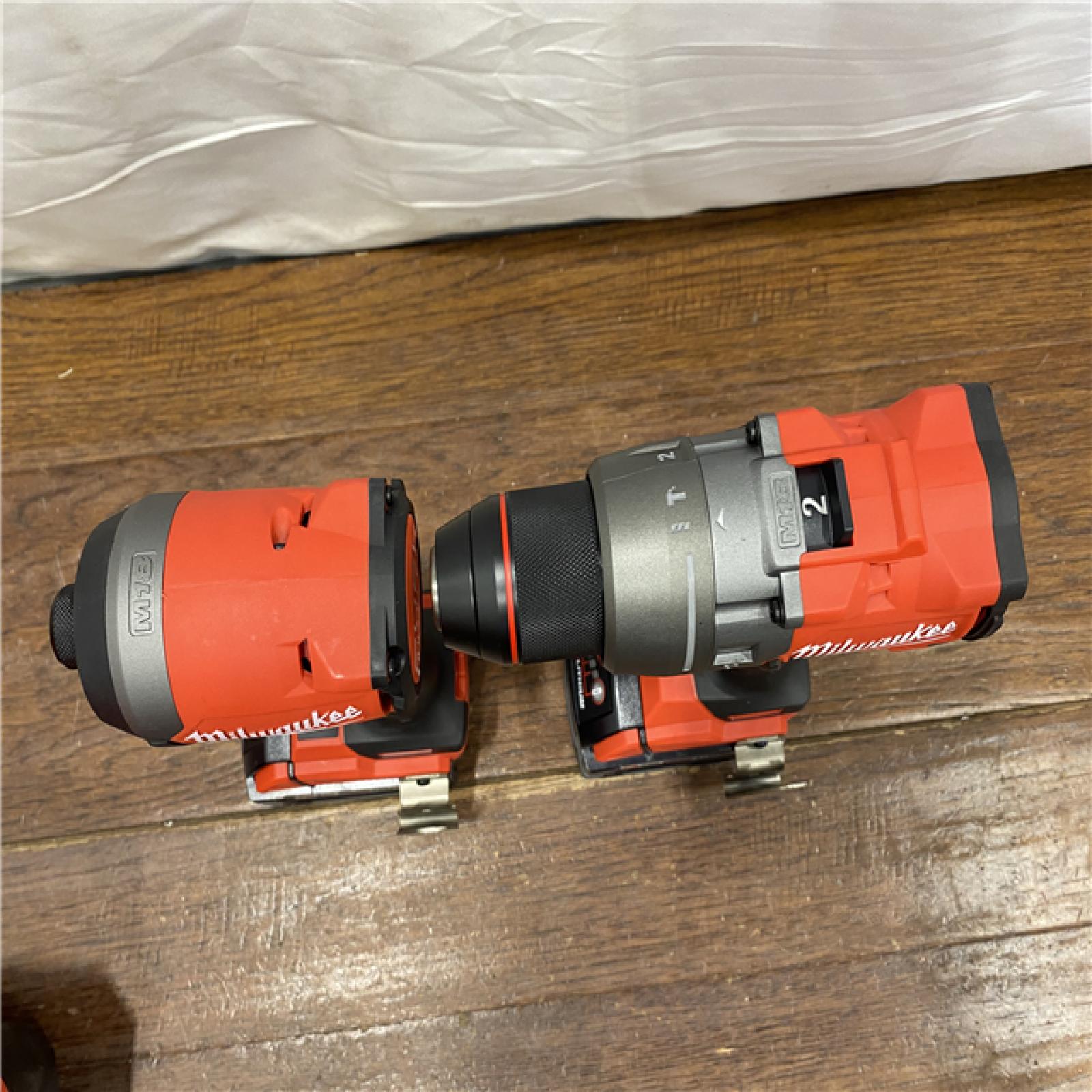 AS-IS MILWAUKEE M18 FUEL 18V Lithium-Ion Brushless Cordless Hammer Drill and Impact Driver Combo Kit (2-Tool) with 2 Batteries