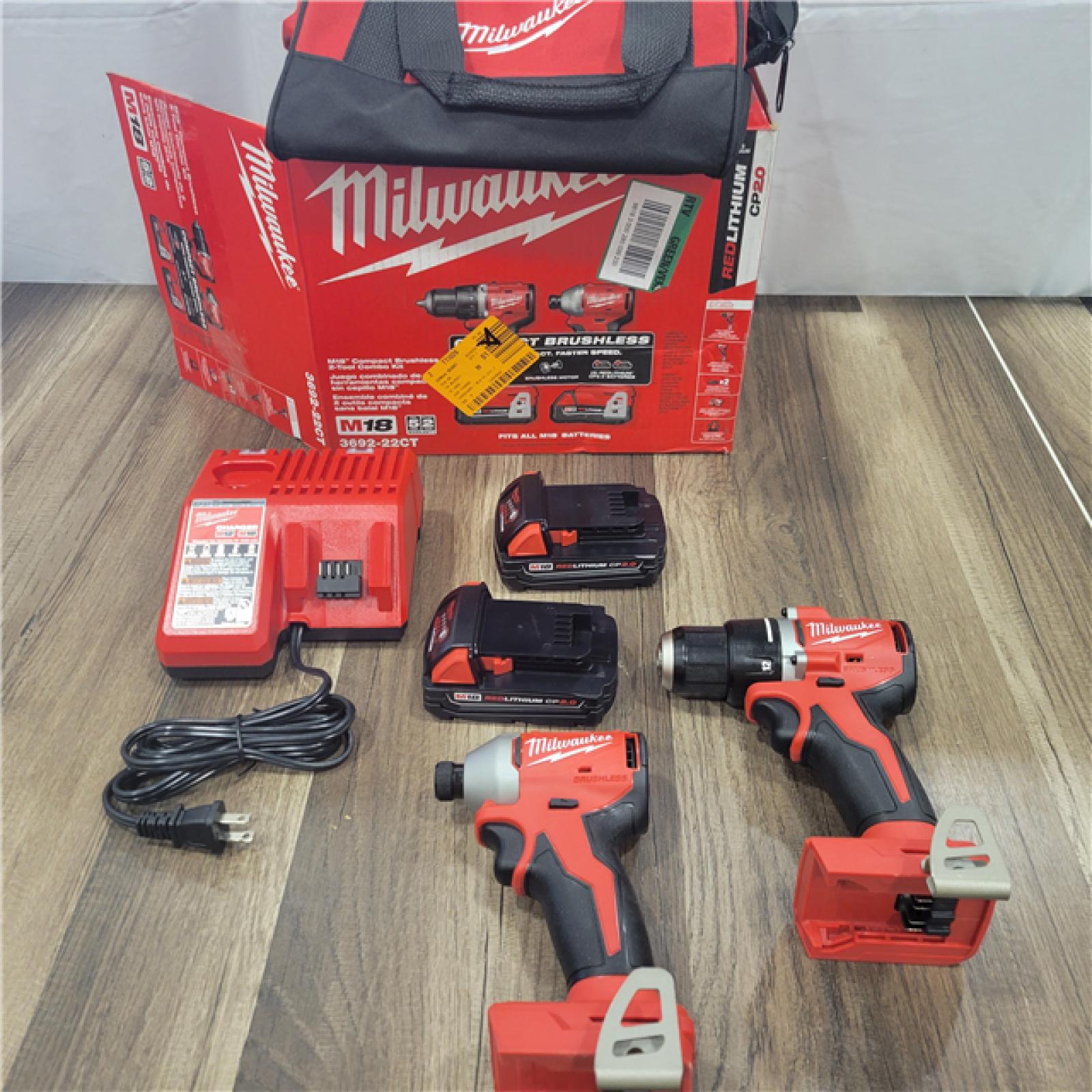 AS-IS Milwaukee M18 18V Lithium-Ion Brushless Cordless Compact Drill/Impact Combo Kit (2-Tool) W/(2) 2.0 Ah Batteries, Charger & Bag